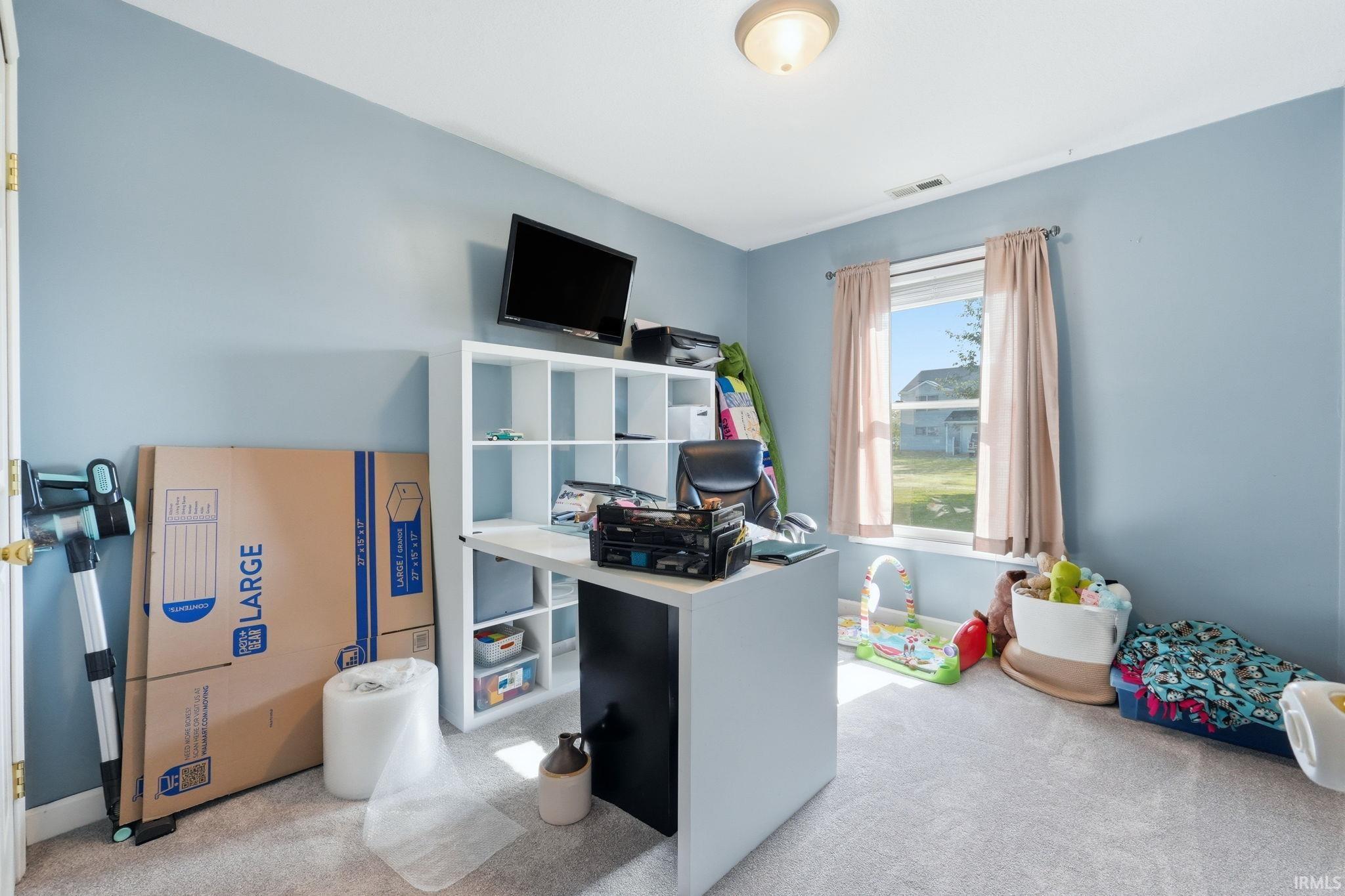 Light blue painted walls with light gray carpeting