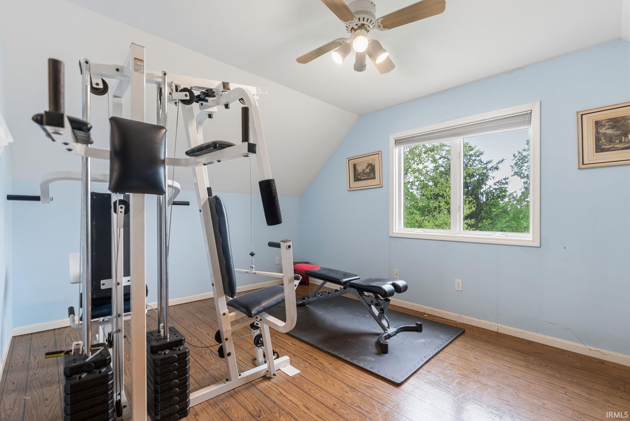 Hardwood-finish flooring complementing light blue walls