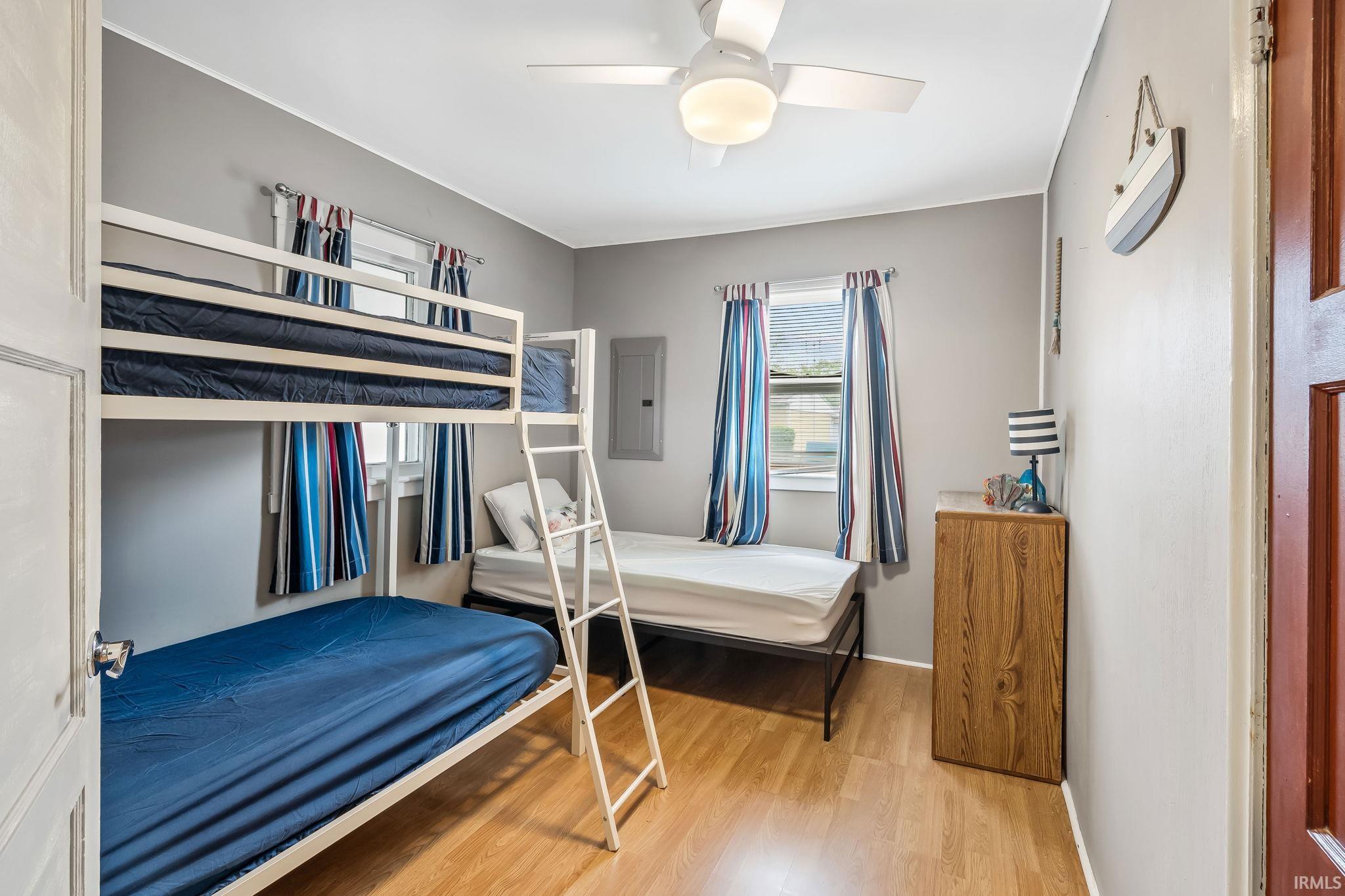 Neutral-toned walls complement the wood-finish flooring