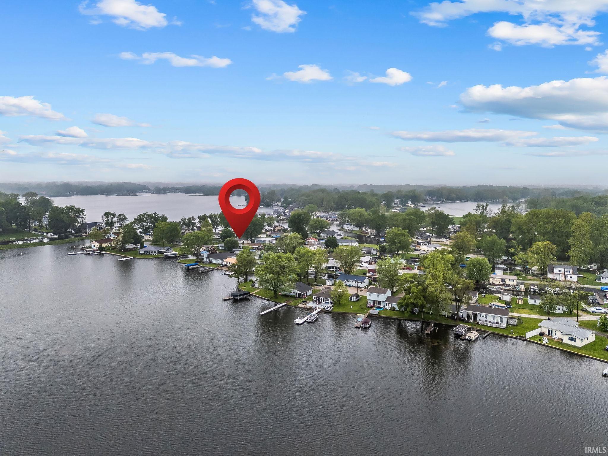 Waterfront community featuring multiple residences with private boat docks