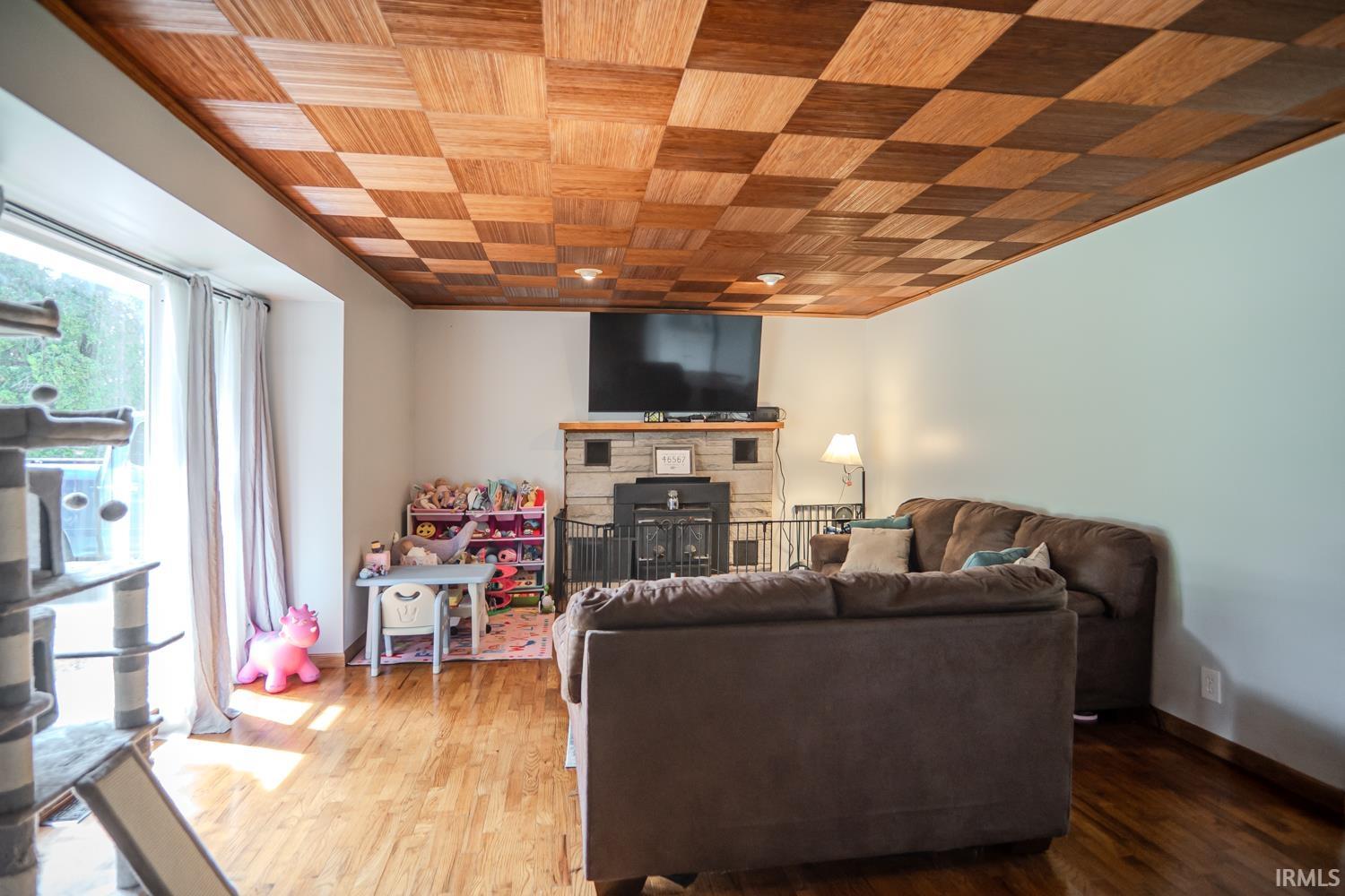 Checkered wood-panel ceiling with recessed lighting