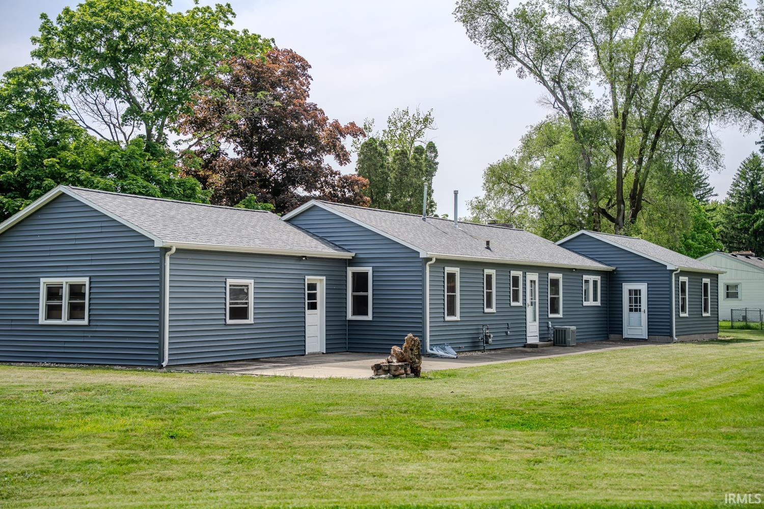 Blue horizontal siding exterior with a light gray shingle roof