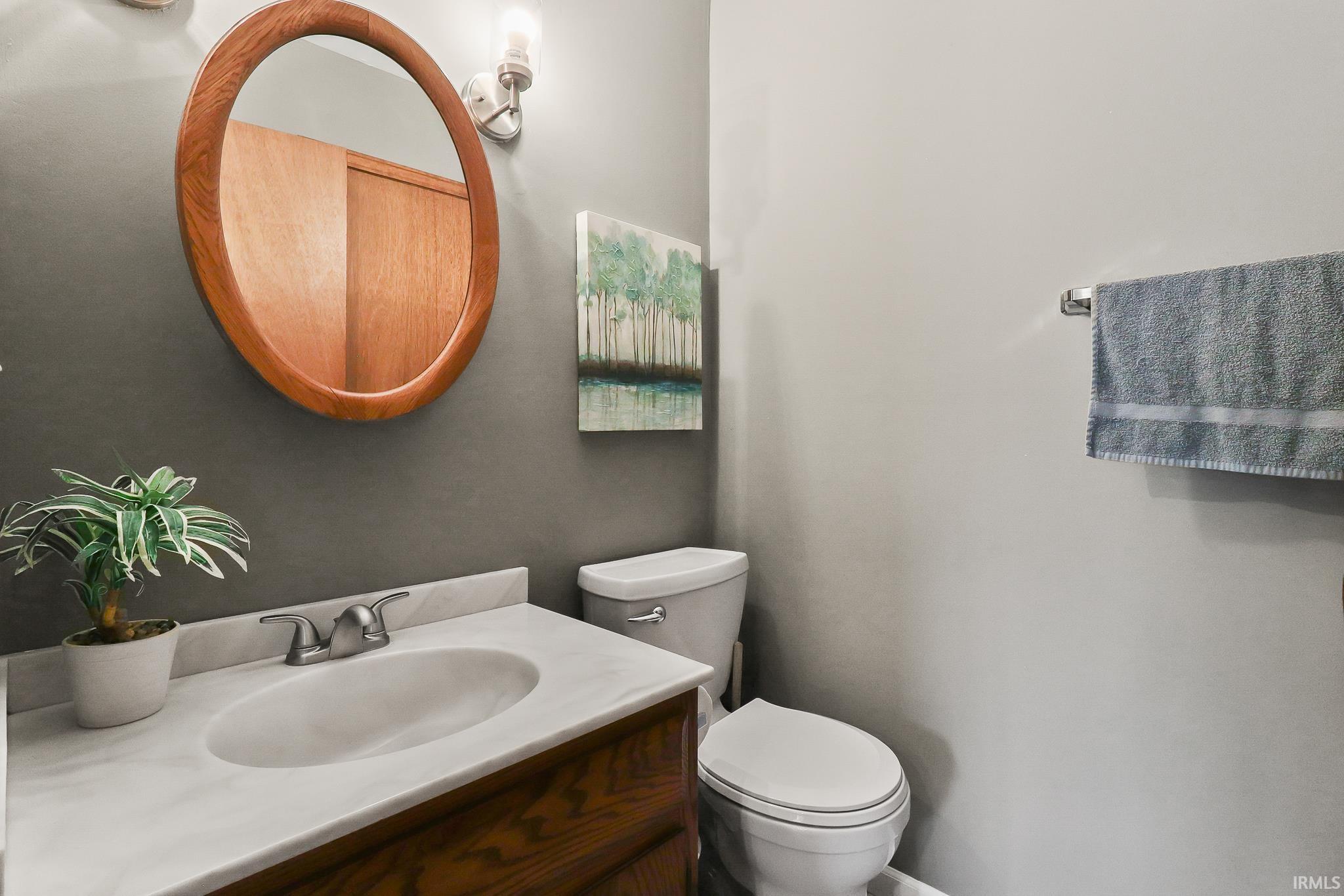 Bathroom vanity with a white countertop and undermount sink