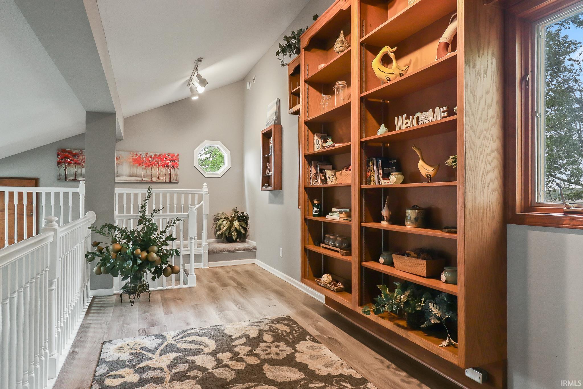 Built-in wood shelving units with ample storage