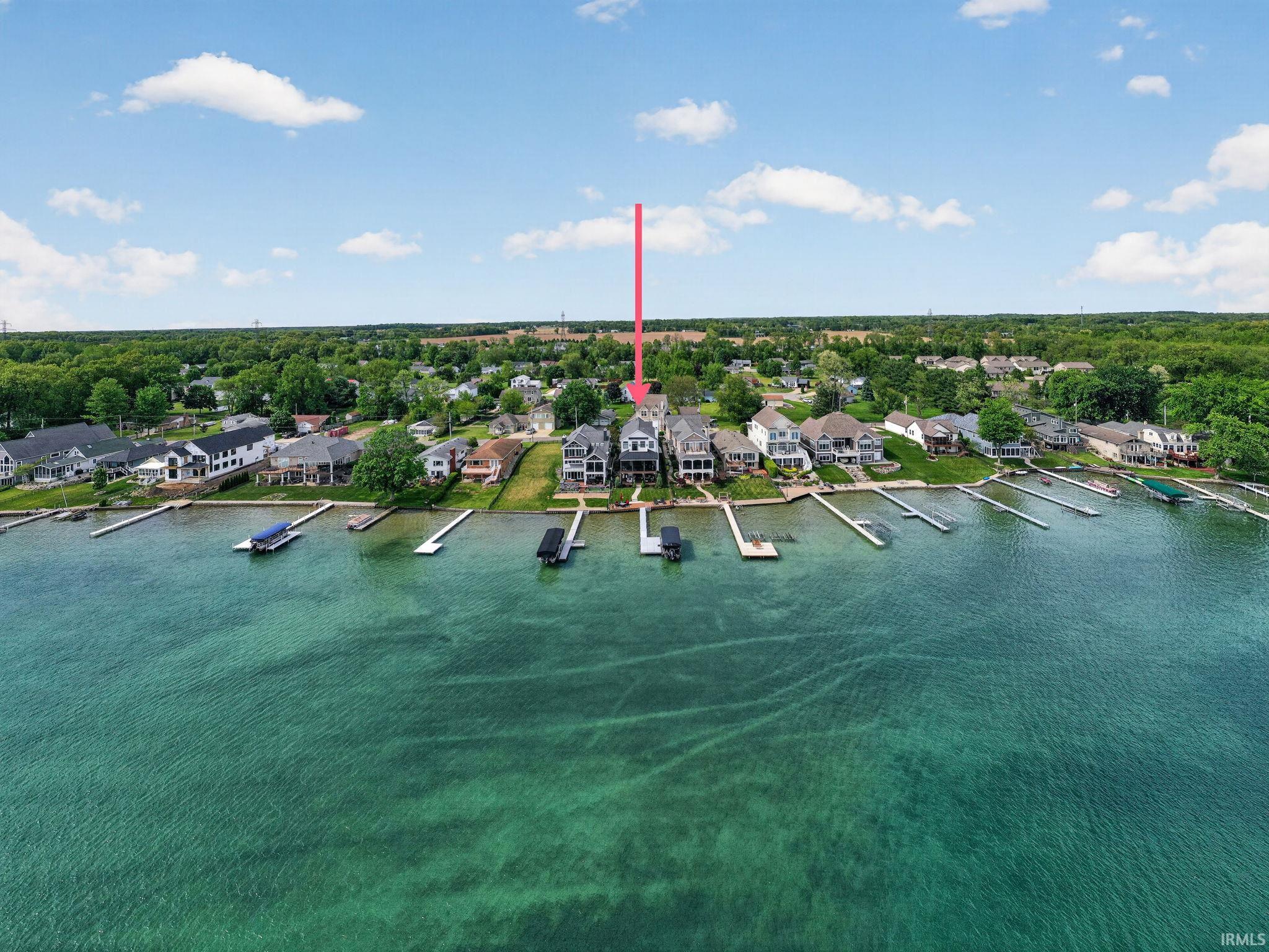 Waterfront residence featuring a private dock with boat lift