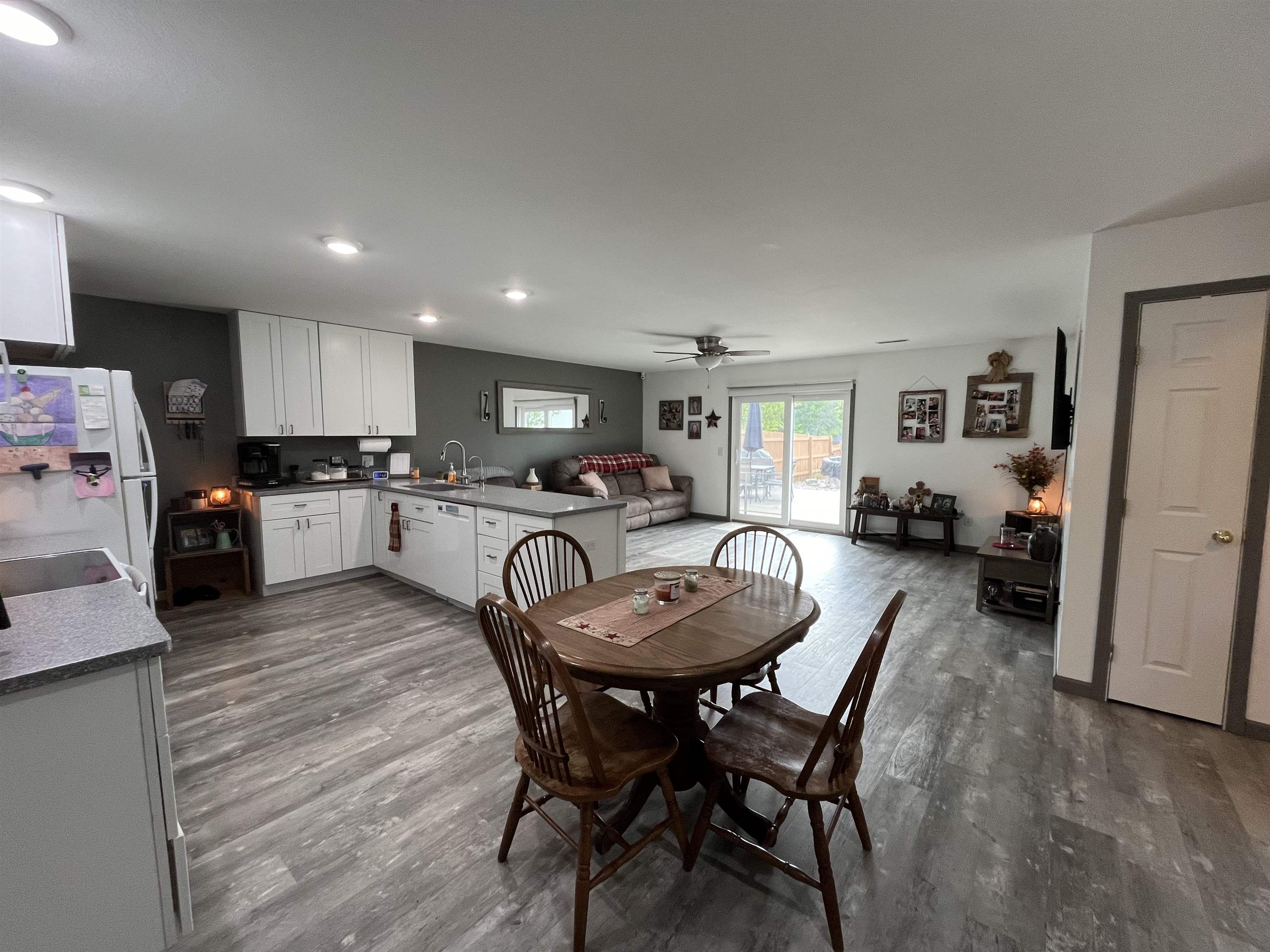 Open-concept interior featuring light wood-finish flooring throughout