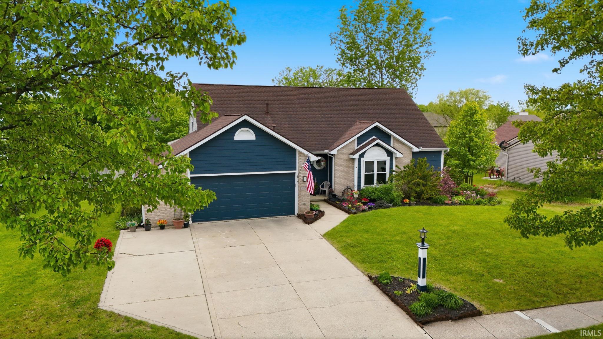 Two-car garage with a concrete driveway