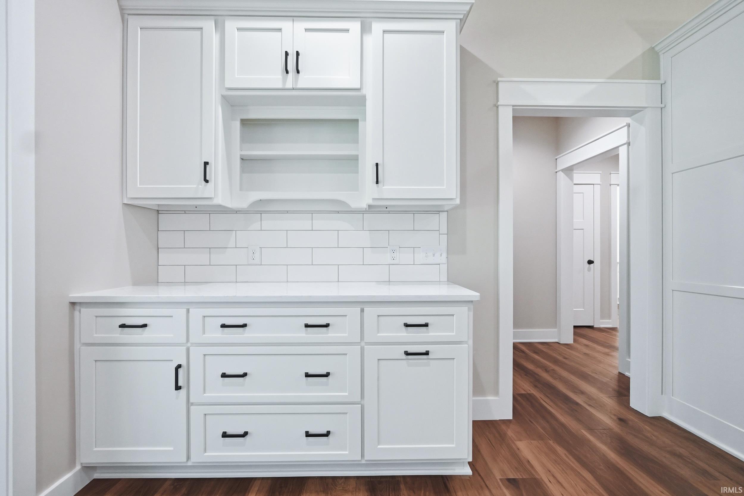 White shaker cabinetry with matte black hardware