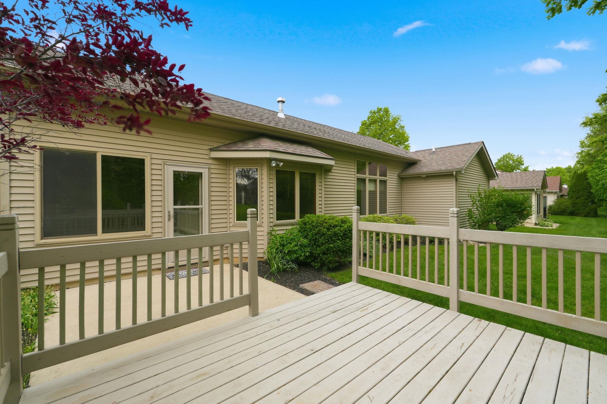 Expansive wood-finish deck with railing