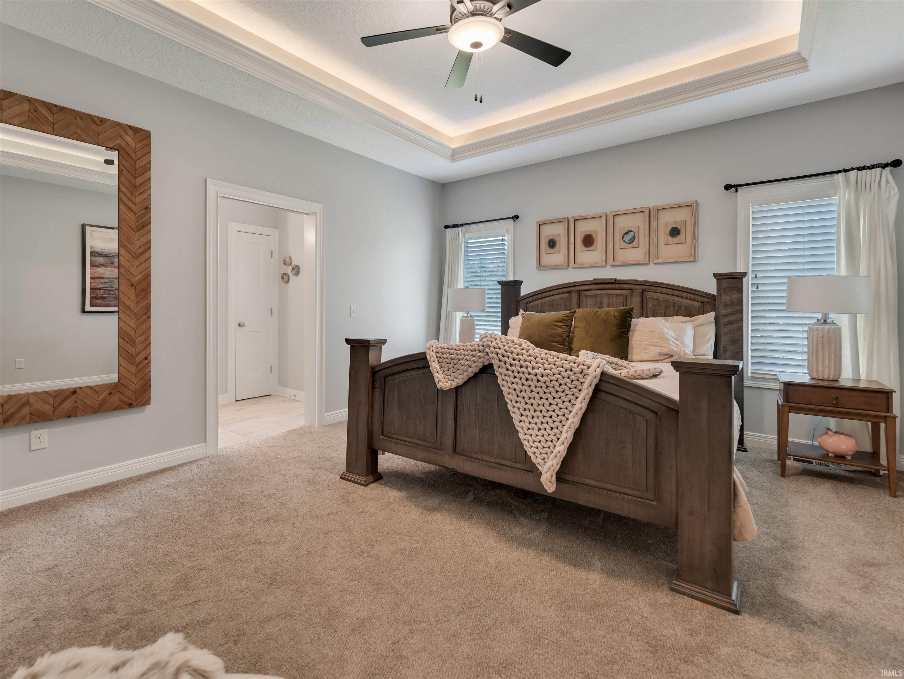 Tray ceiling with recessed lighting and a ceiling fan