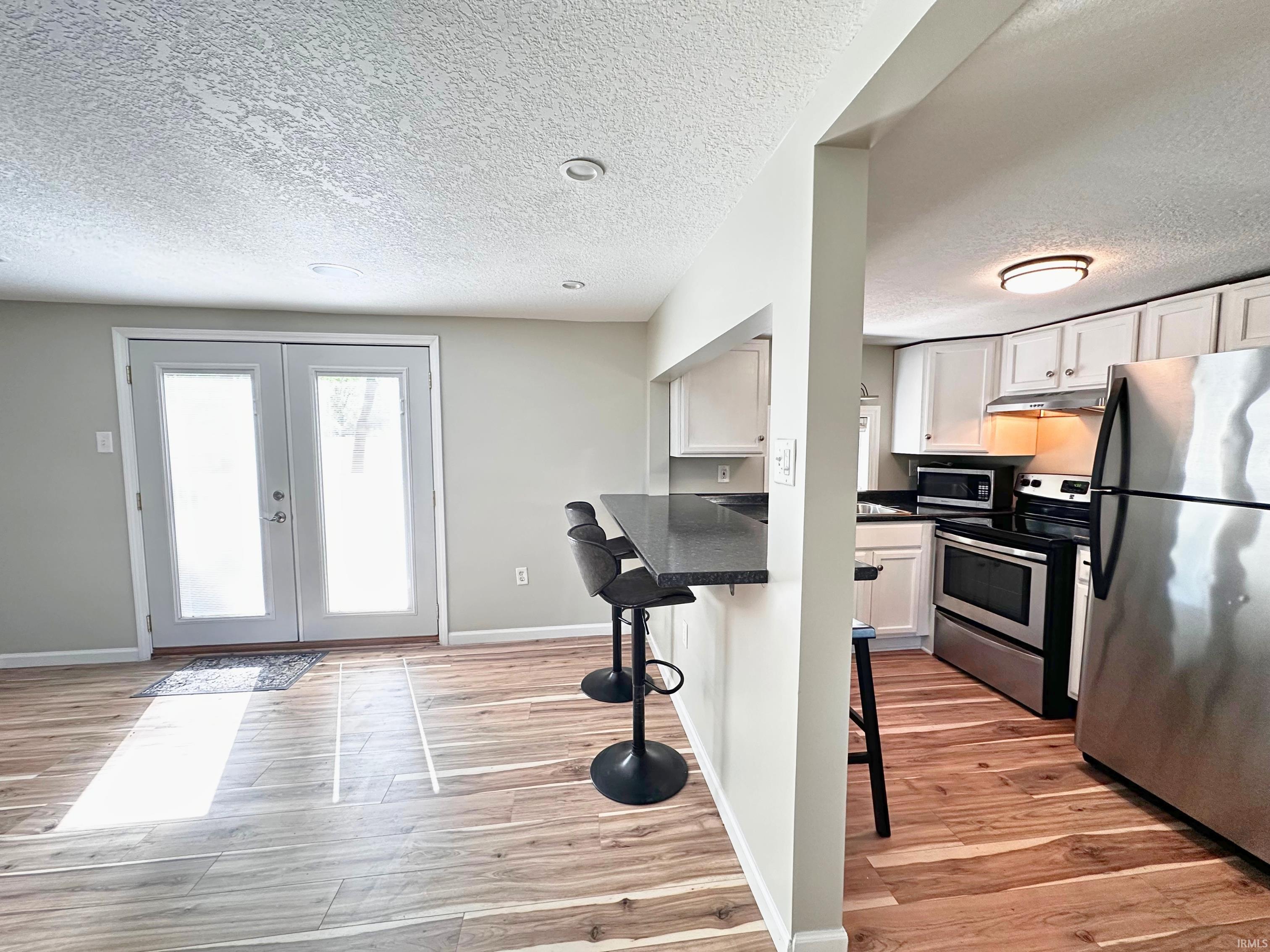 Kitchen featuring the breakfast nook, which is perfectly located! If you are entertaining inside, the open floor-plan allows any hostess to engage while prepping any meal!