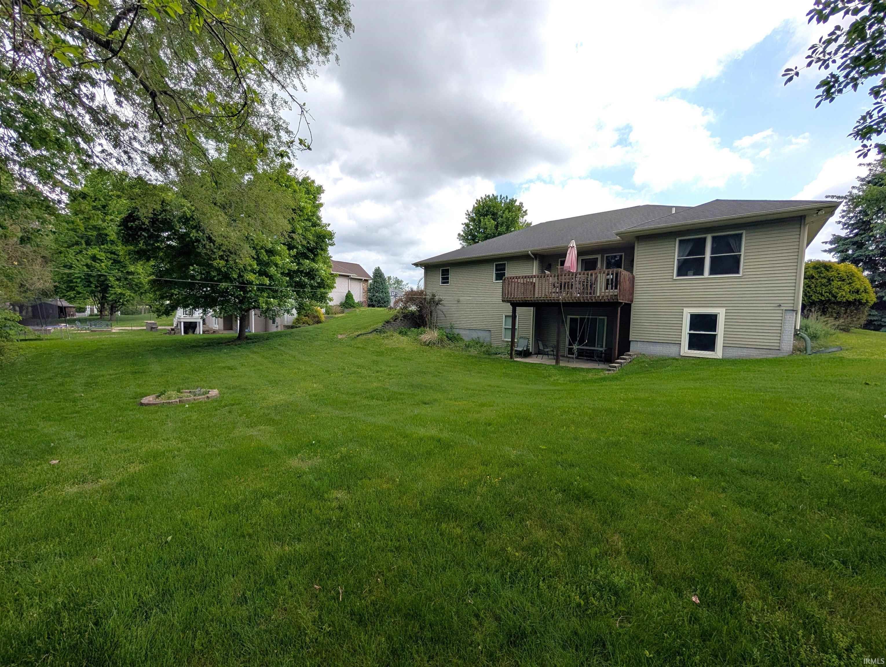 Expansive green lawn providing ample outdoor space