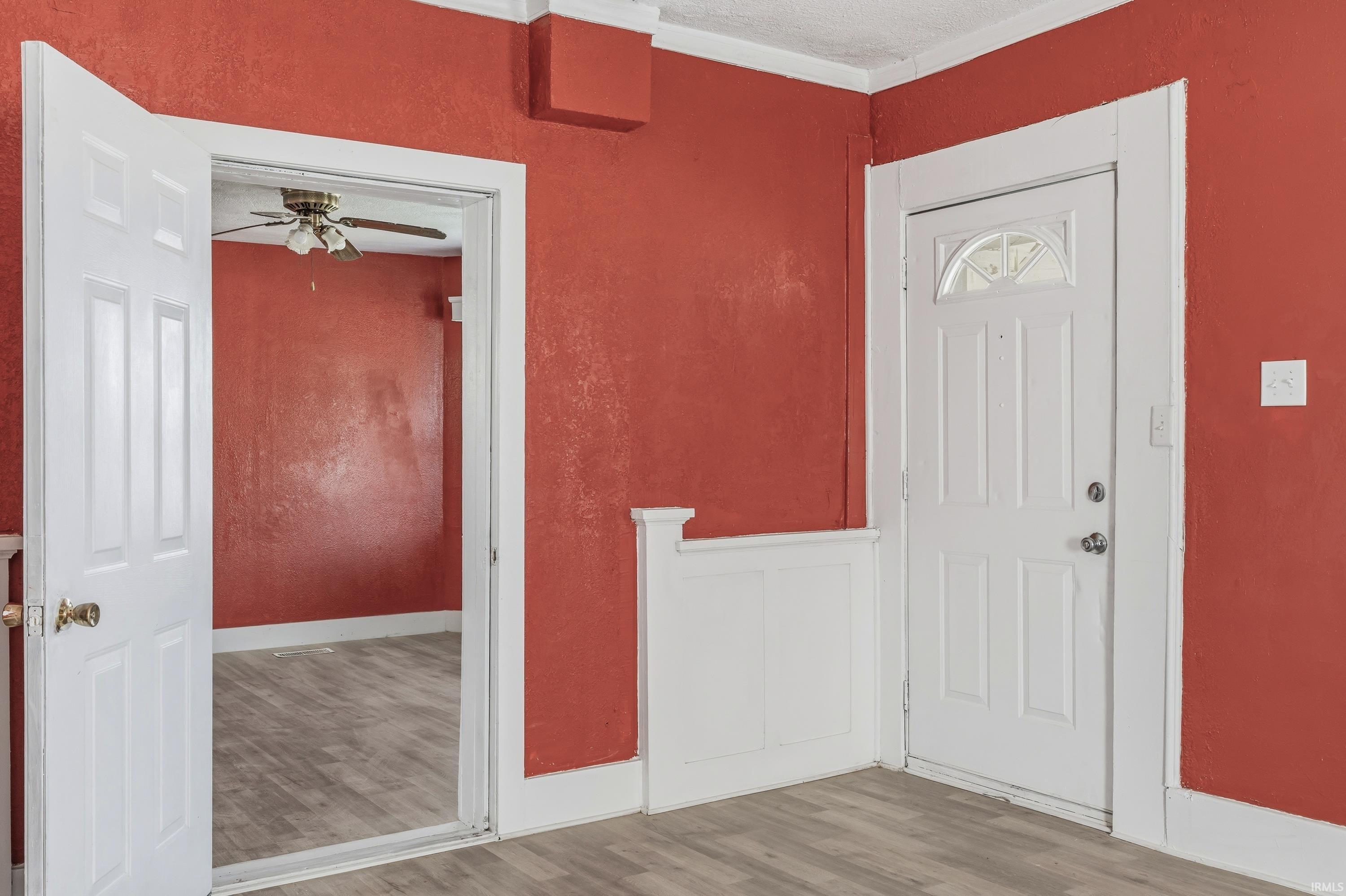 Interior space featuring wood-finish flooring and solid core doors