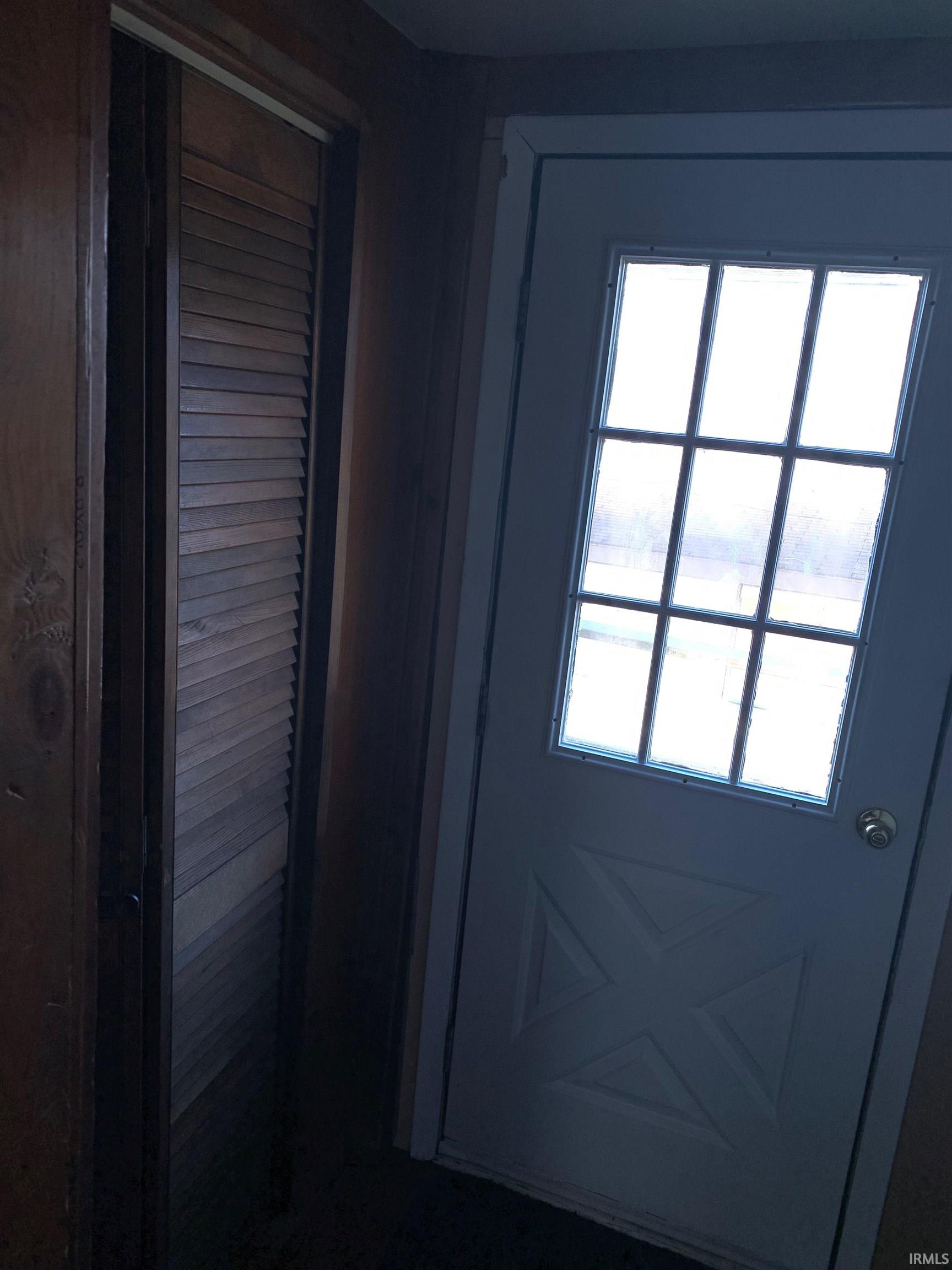 White multi-pane door with prominent X-design detail