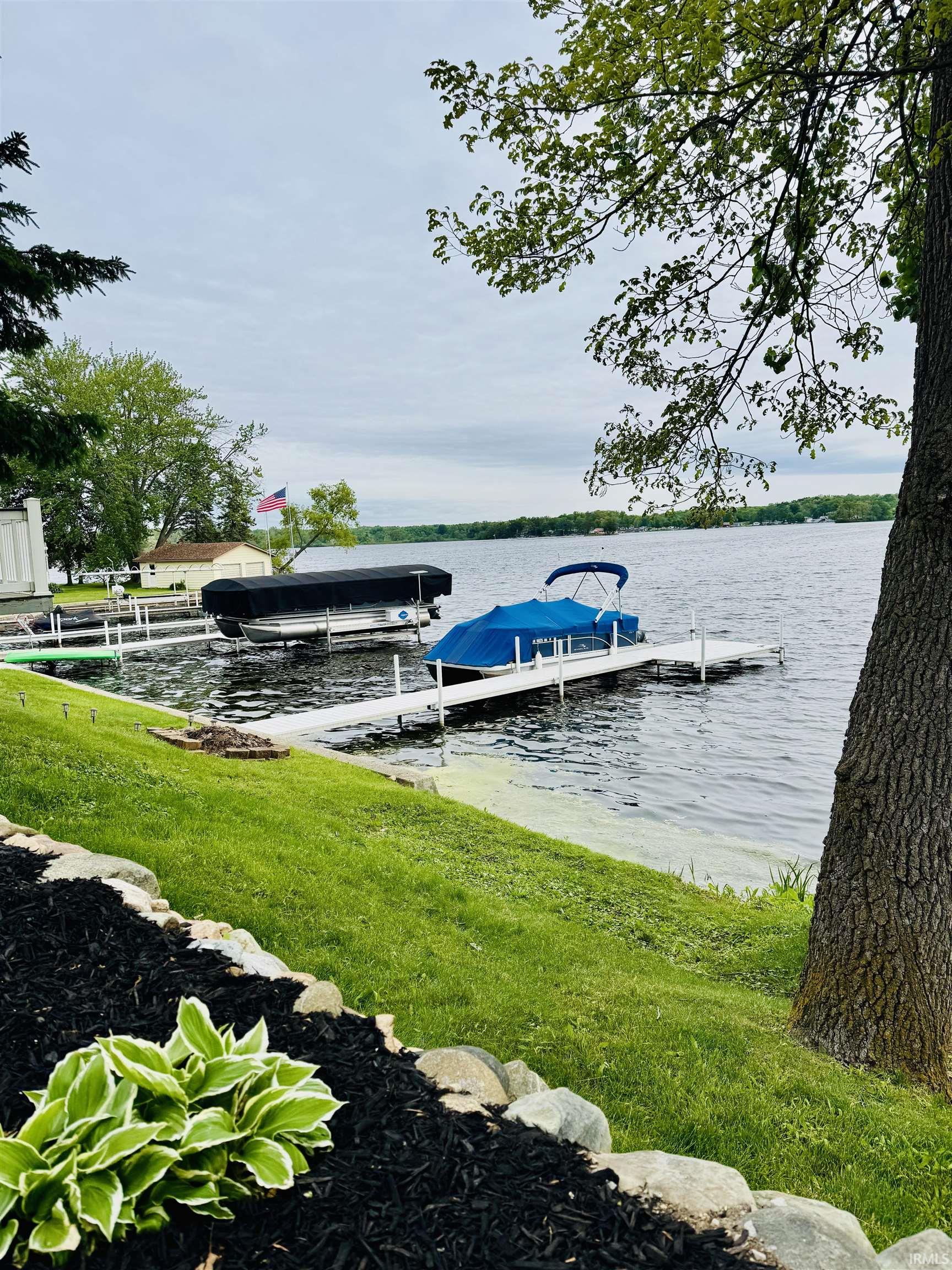 Waterfront property featuring multiple docks and direct water access