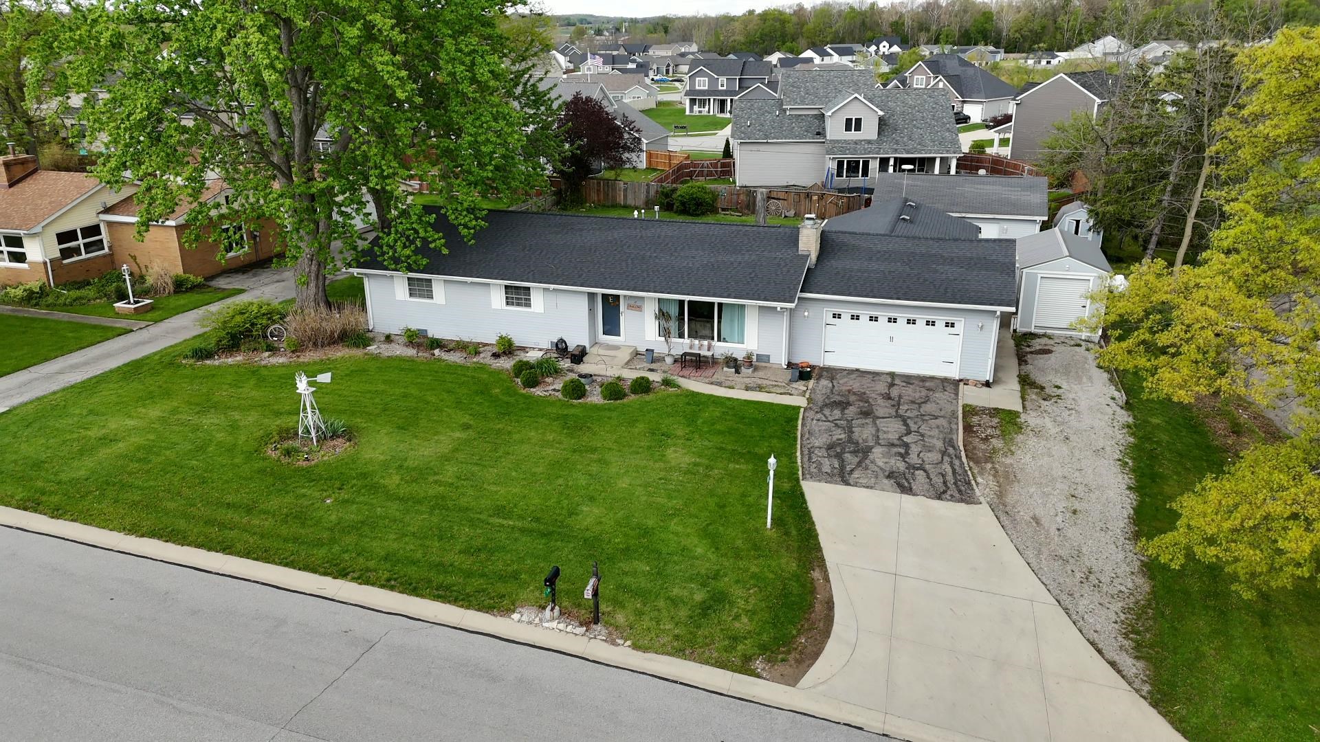 Light gray exterior with a dark shingle roof