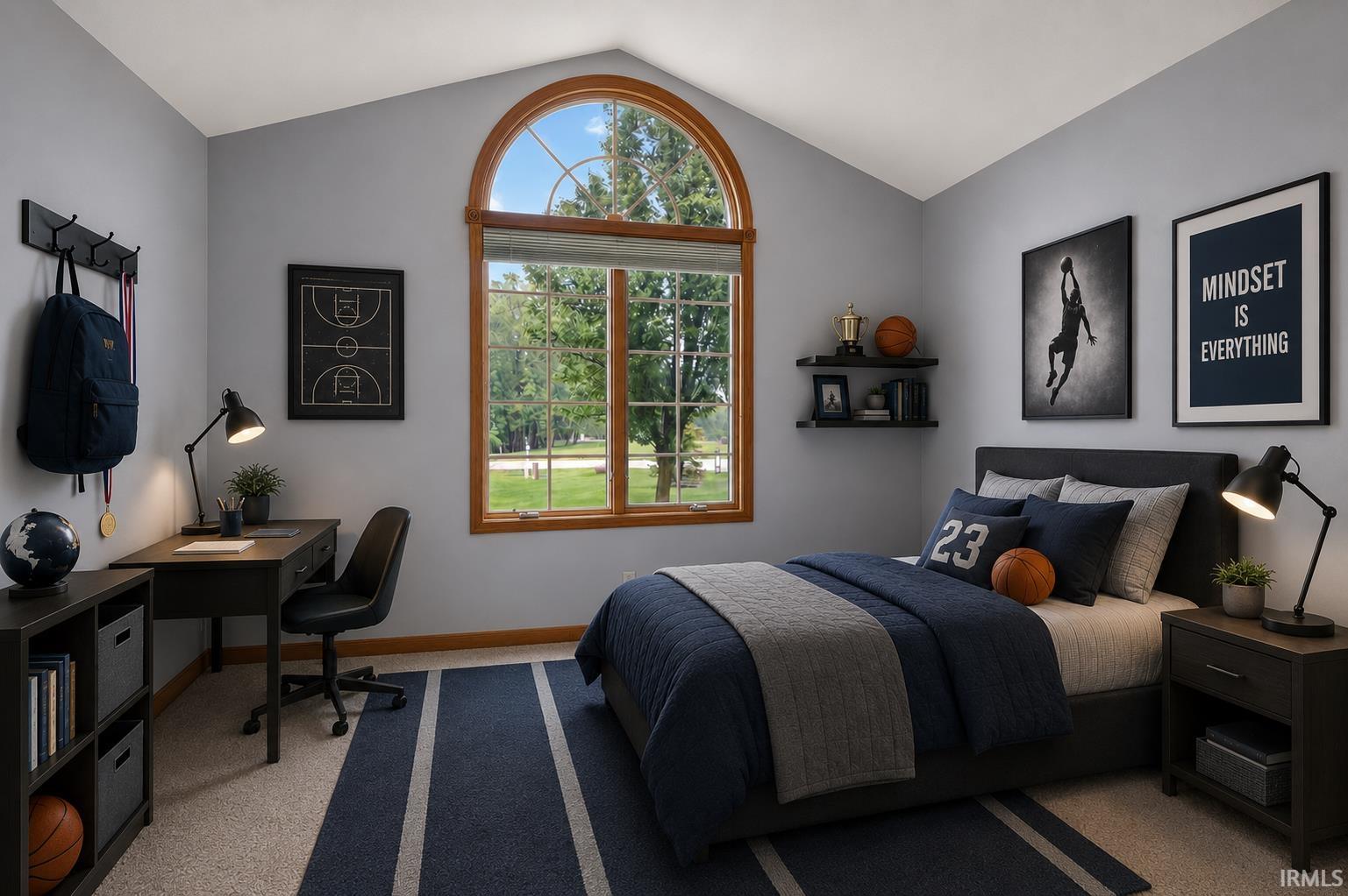 Vaulted ceiling bedroom with a large arched top window overlooking greenery