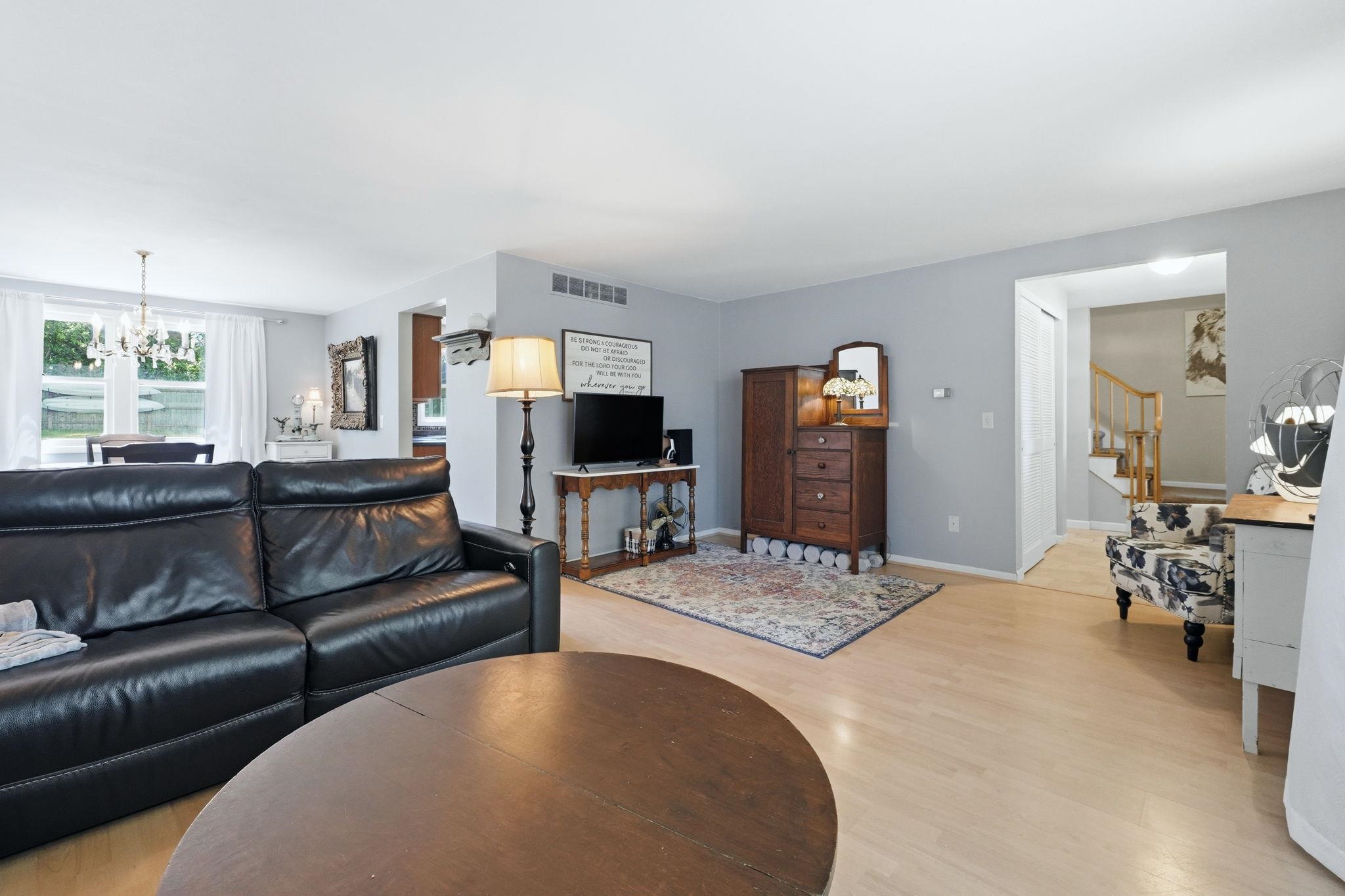 Expansive living area with light wood-finish flooring