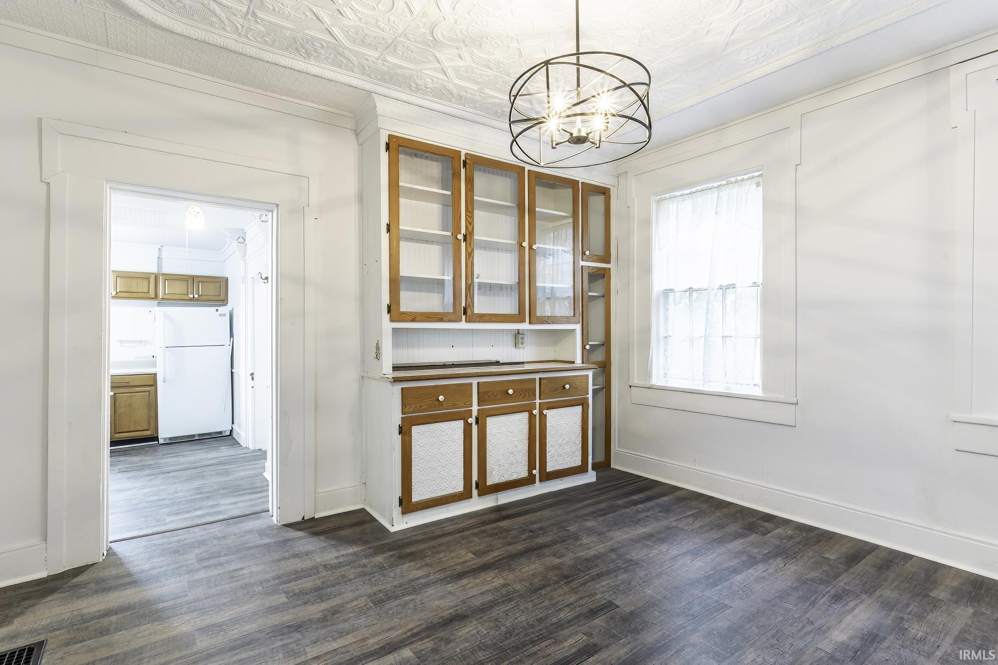 Built-in hutch with glass-front upper cabinetry and lower storage