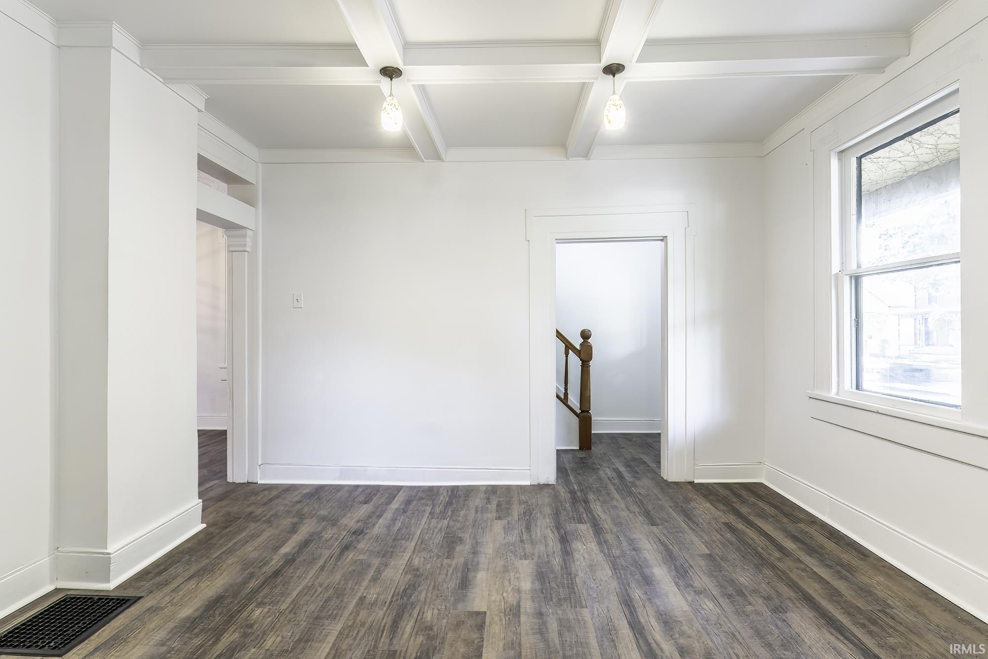 Bright interior with wood-finish flooring and white walls