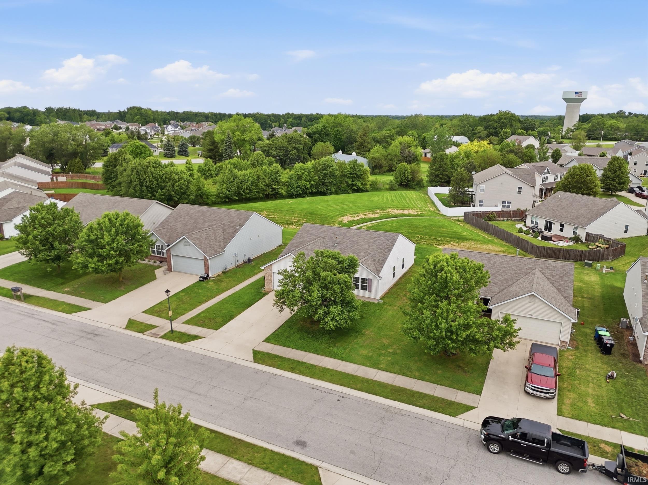 Single-story residence featuring a neutral exterior, an attached two-car garage, and a concrete driveway