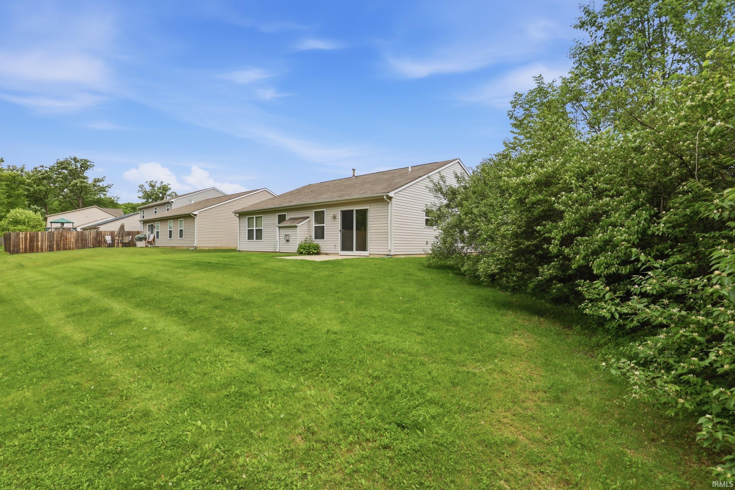 Expansive green lawn providing ample outdoor space