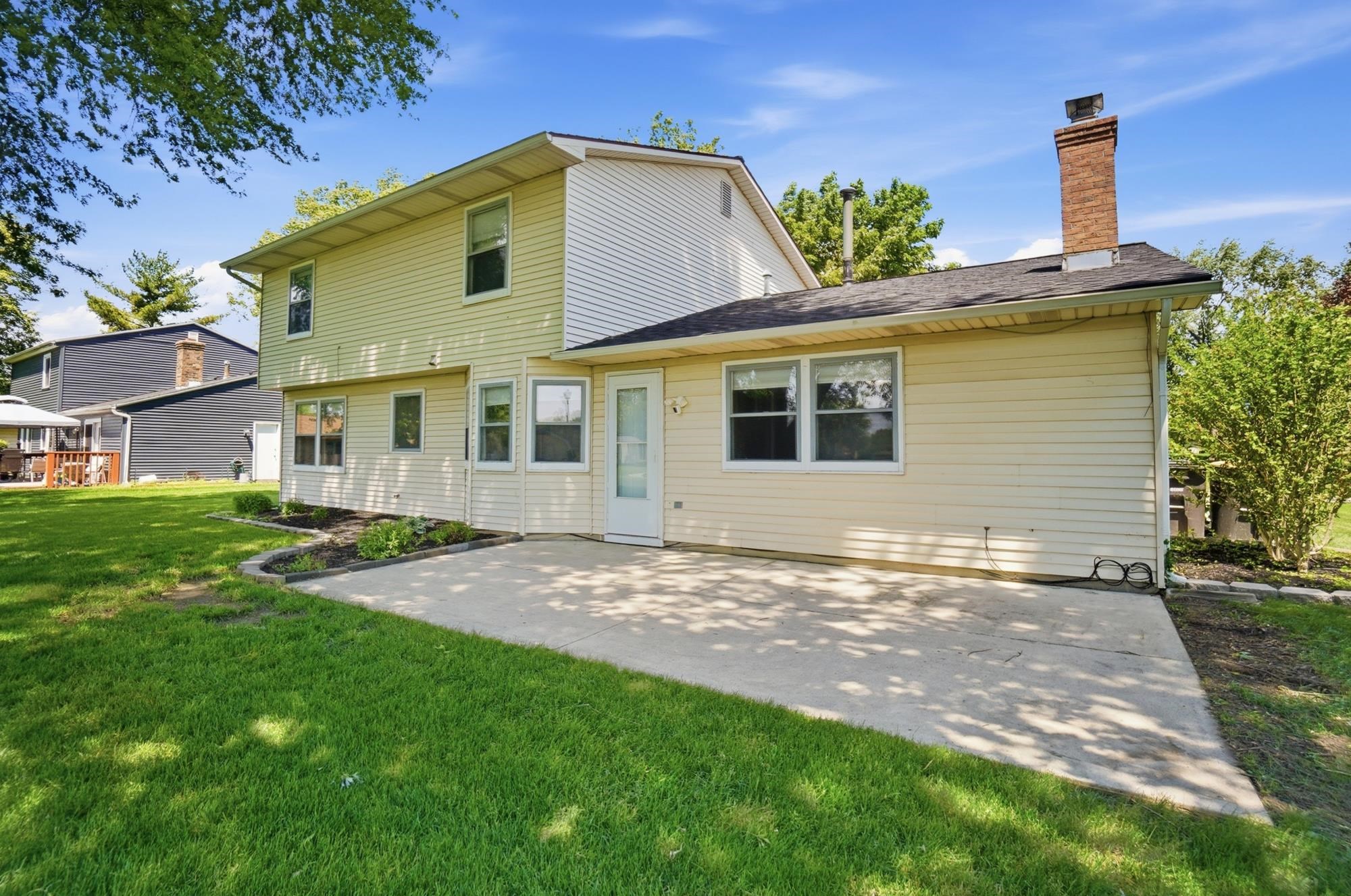 Two-story residence with light-colored siding