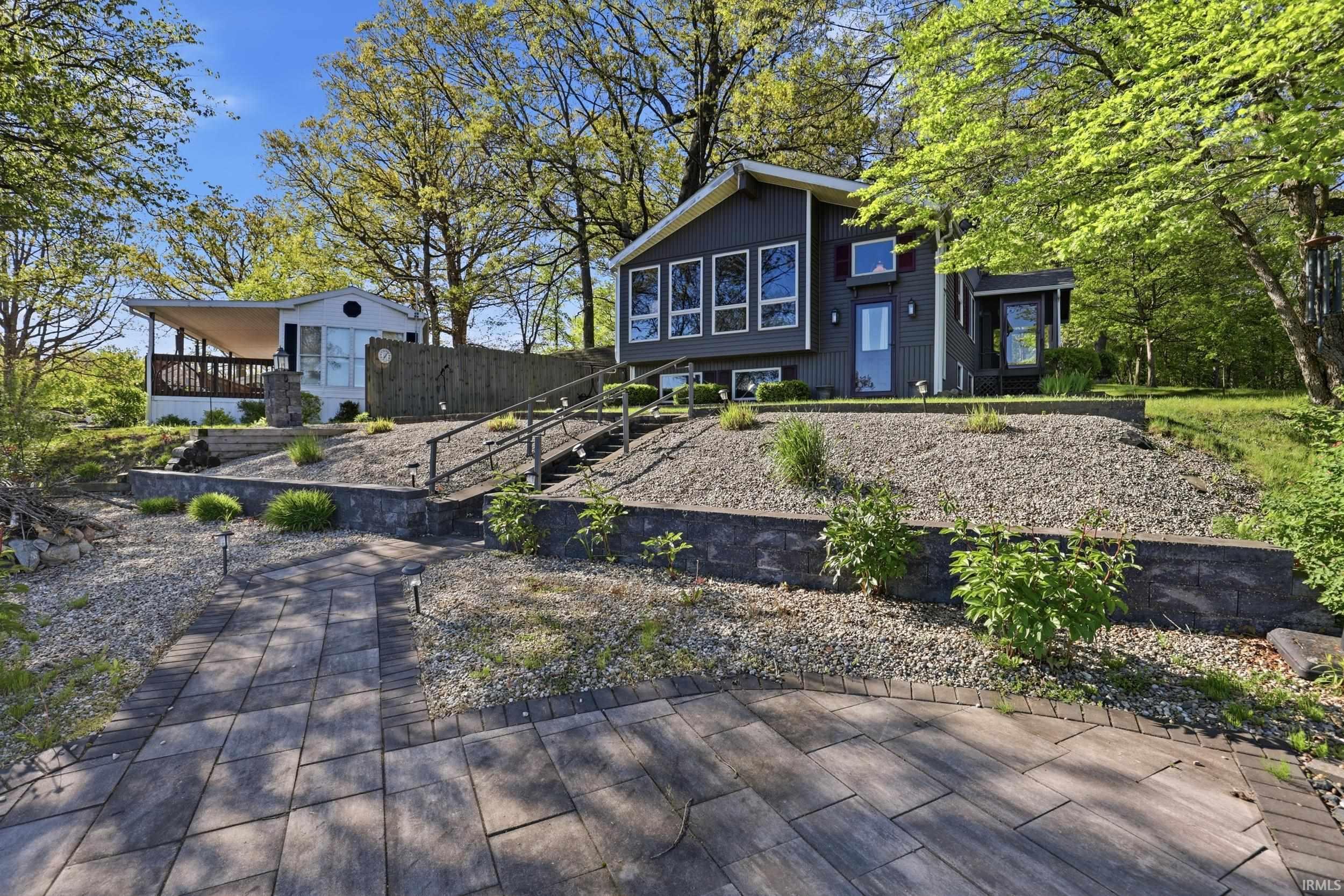 Contemporary exterior featuring dark siding and multiple windows