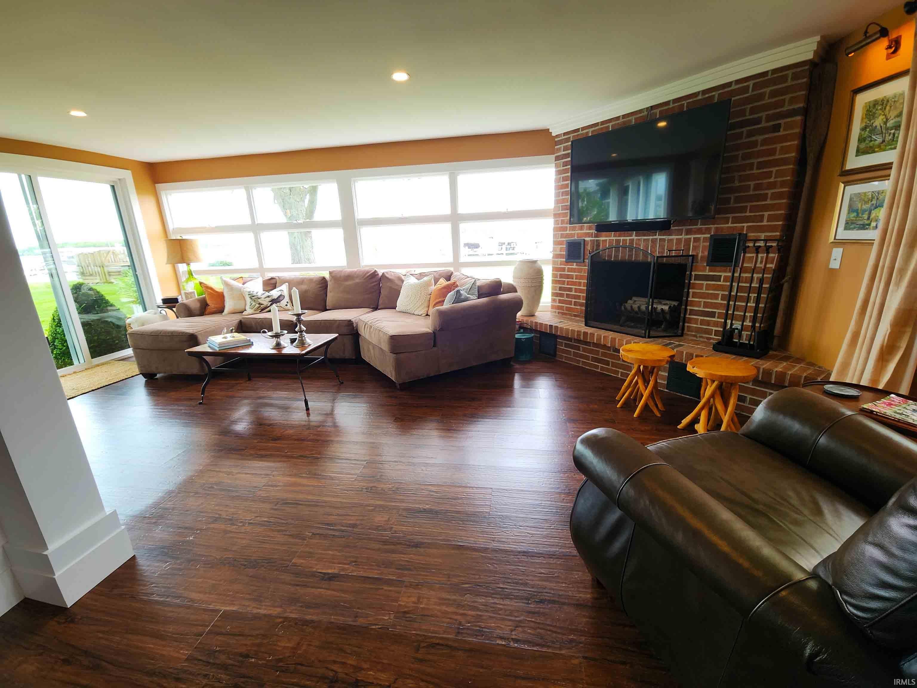 Great room with fireplace toward lake.