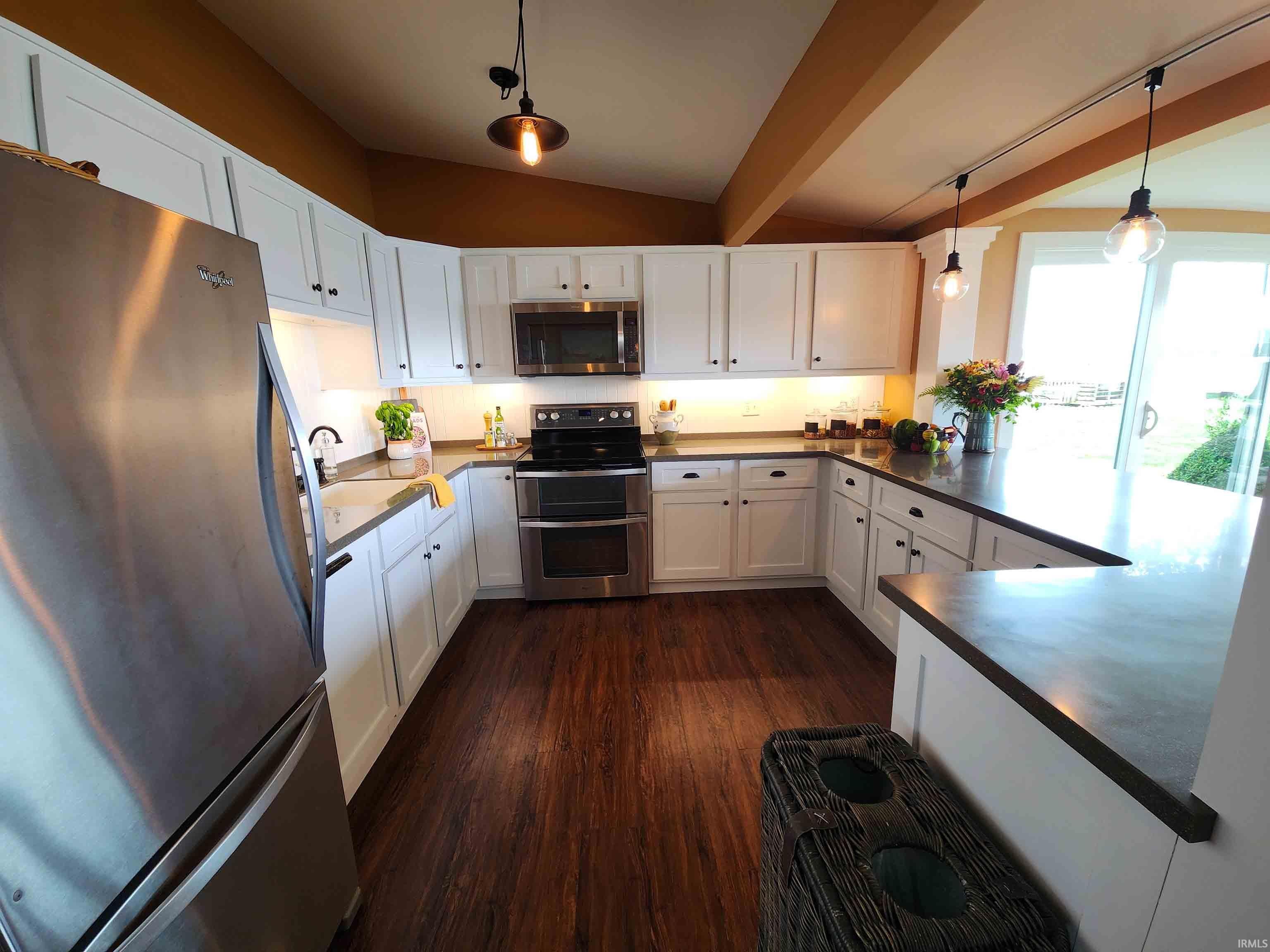 Kitchen with bar to right.