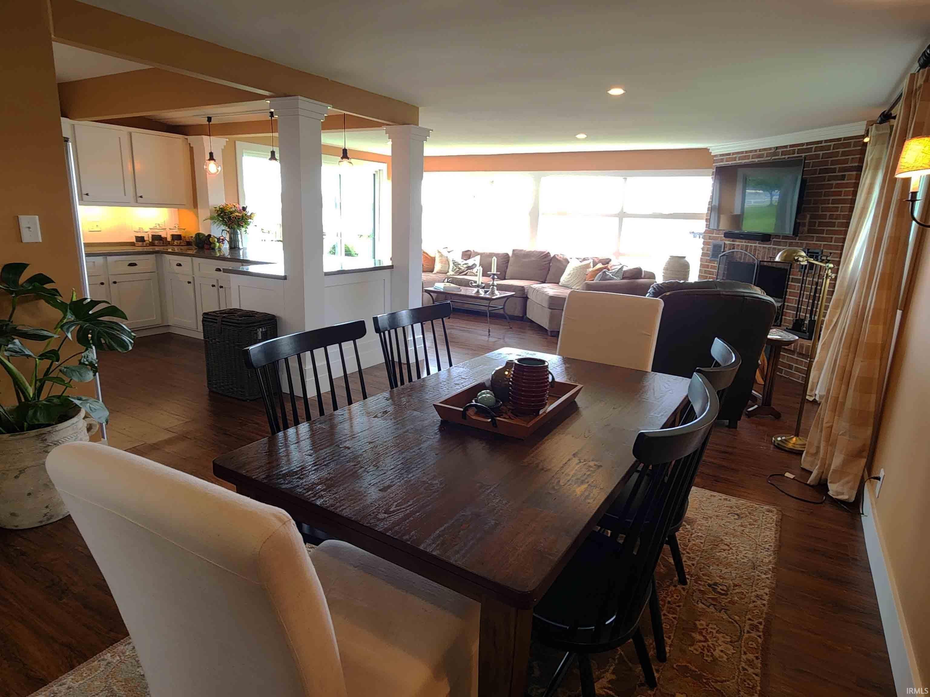 Dining area with kitchen to left.