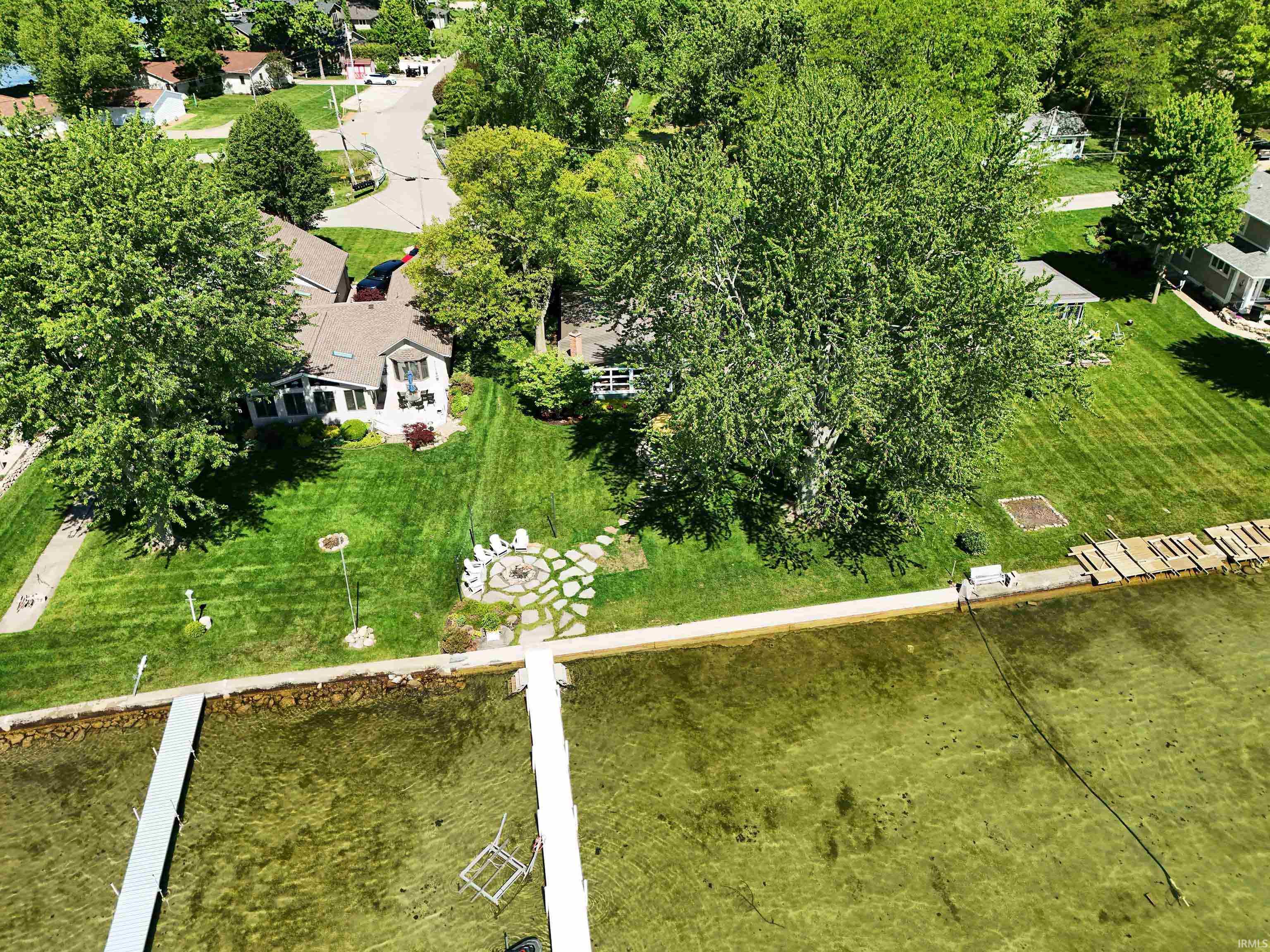 Aerial view of home and 80 feet of lakefront.