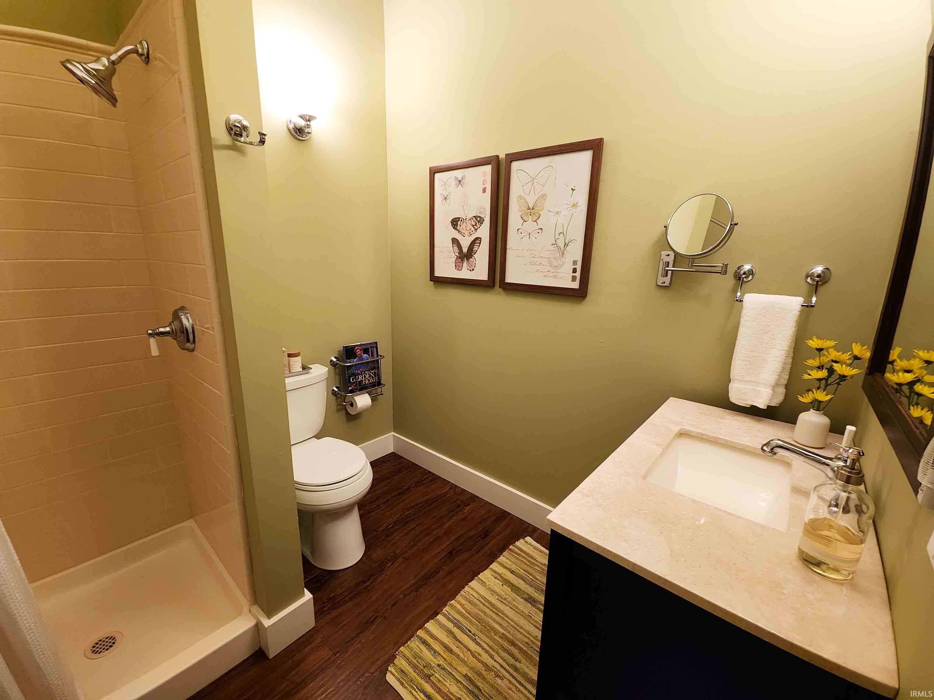 First bathroom with shower and toilet.