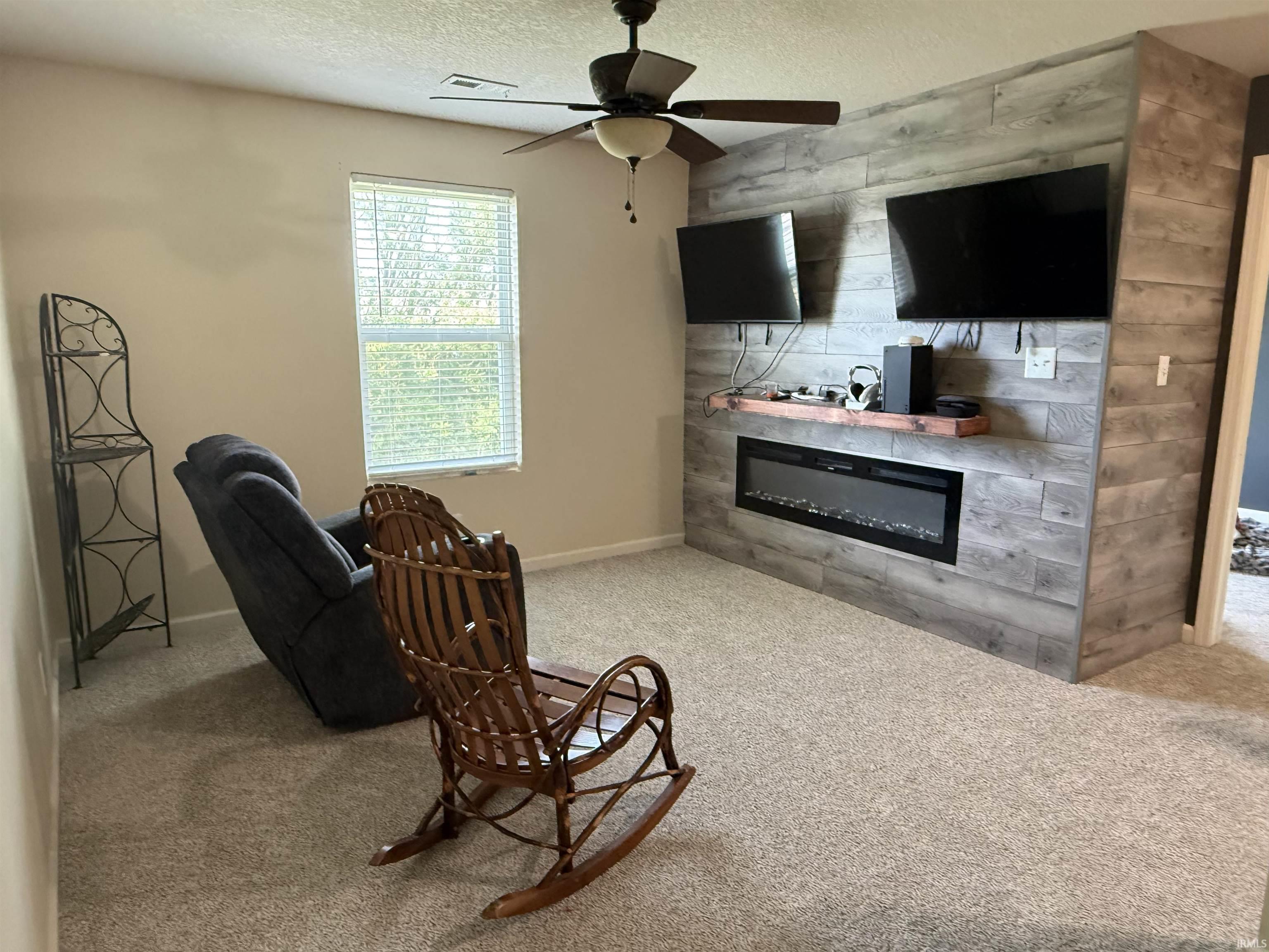 Feature wall with horizontal wood-finish paneling and an integrated electric fireplace