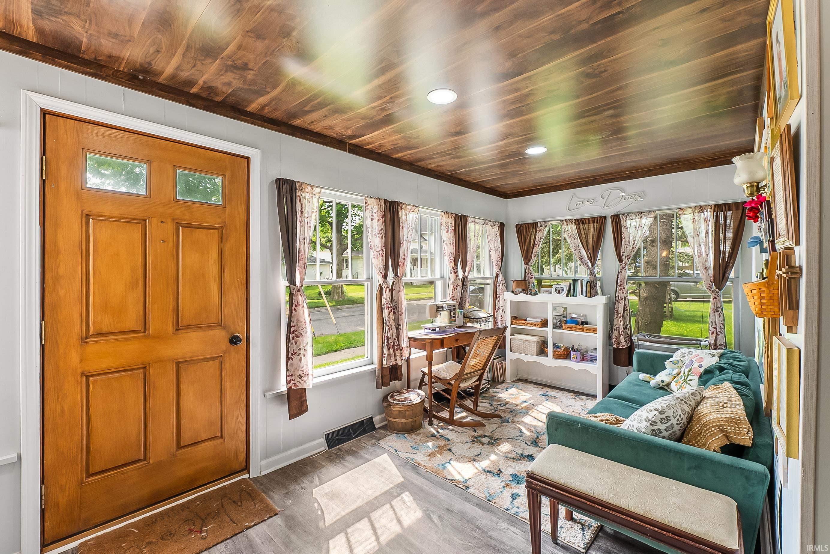 Wood-paneled ceiling with recessed lighting