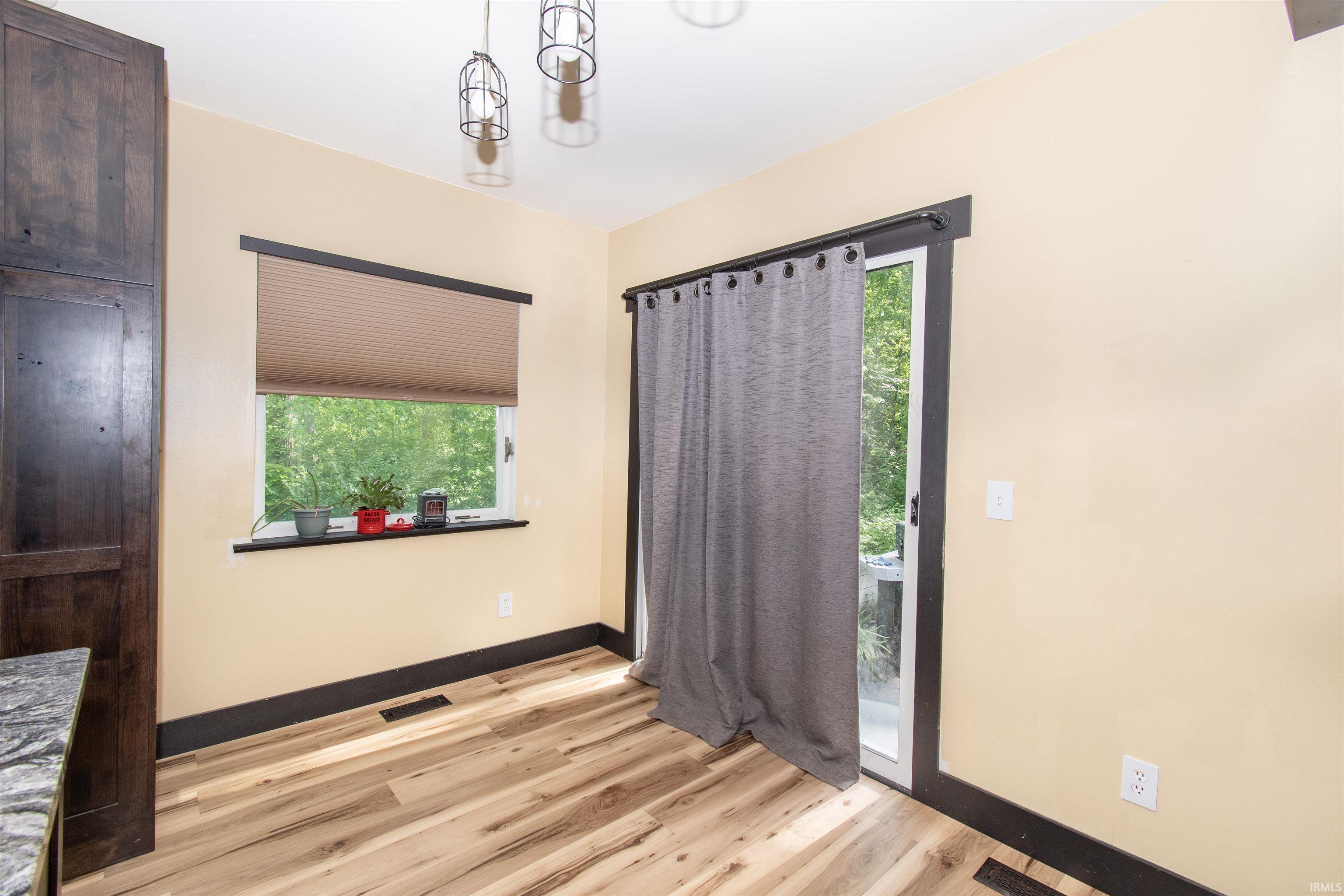 Wood-finish flooring with dark trim details