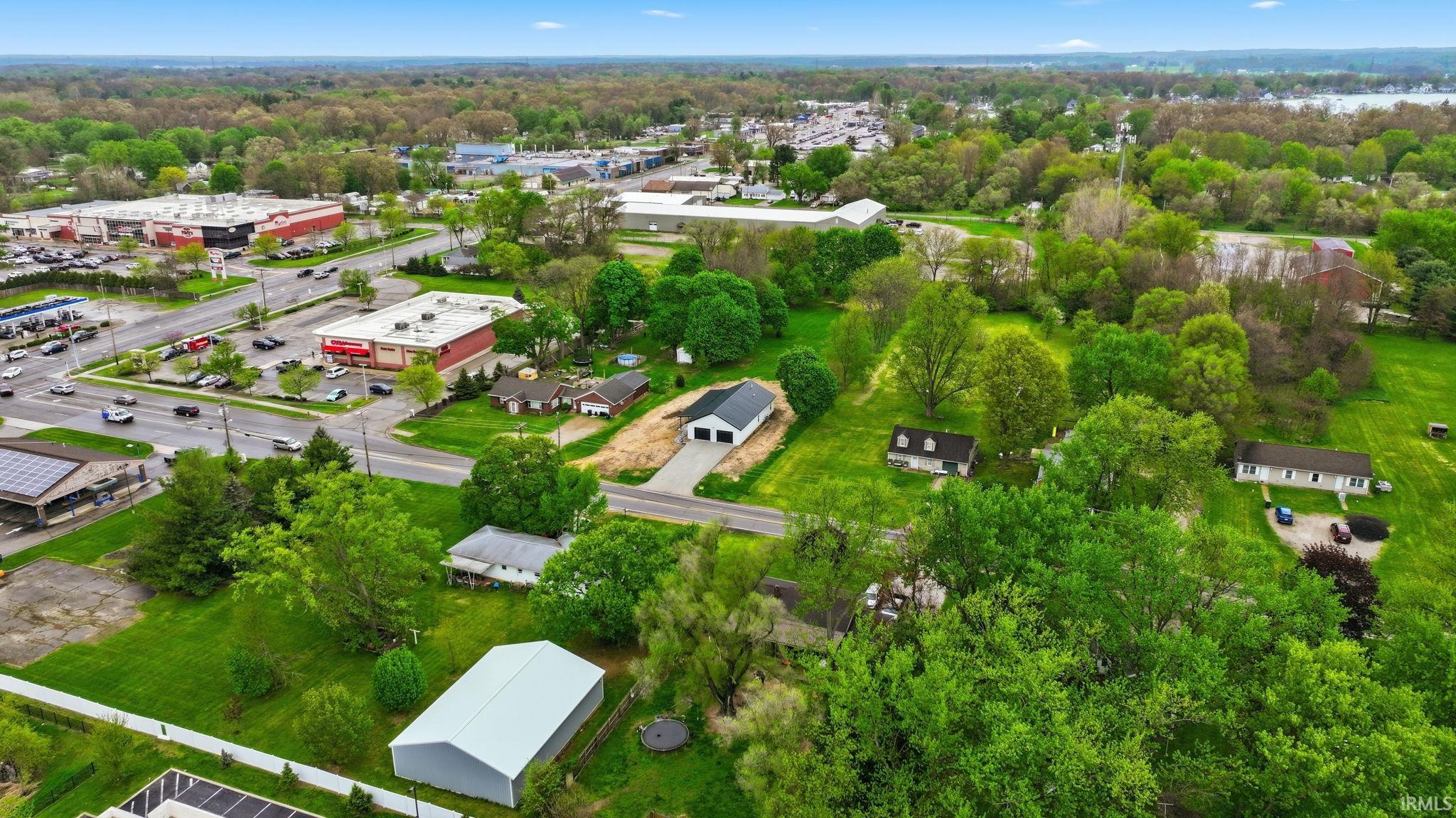 Expansive aerial view showcasing the property's generous green space