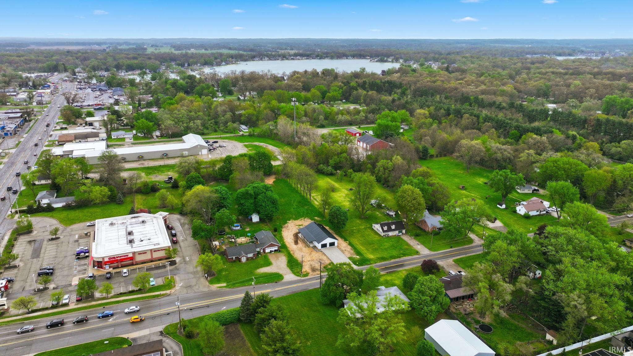 Aerial perspective showcasing a residential and commercial area with abundant greenery