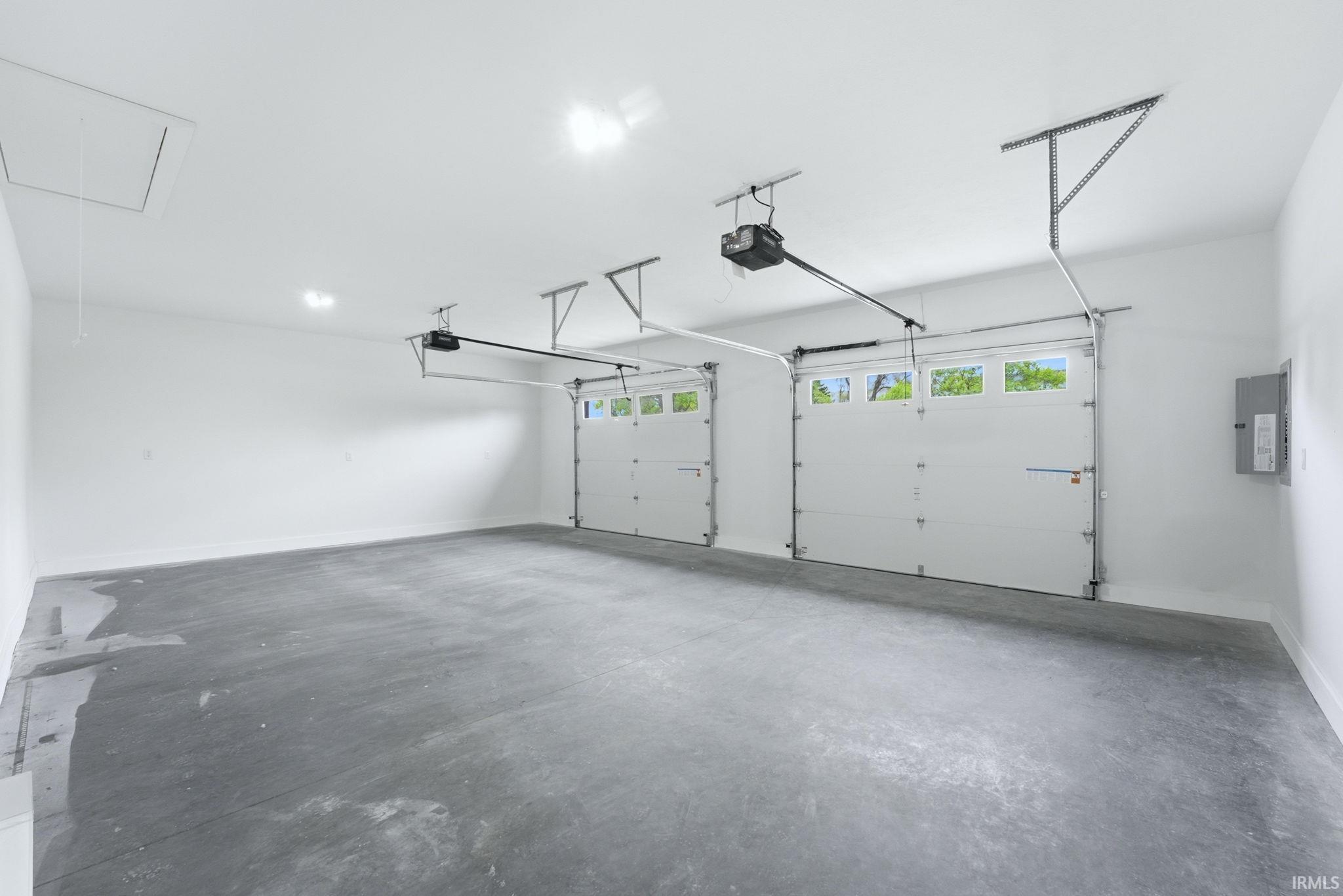 Spacious two-car garage with concrete flooring