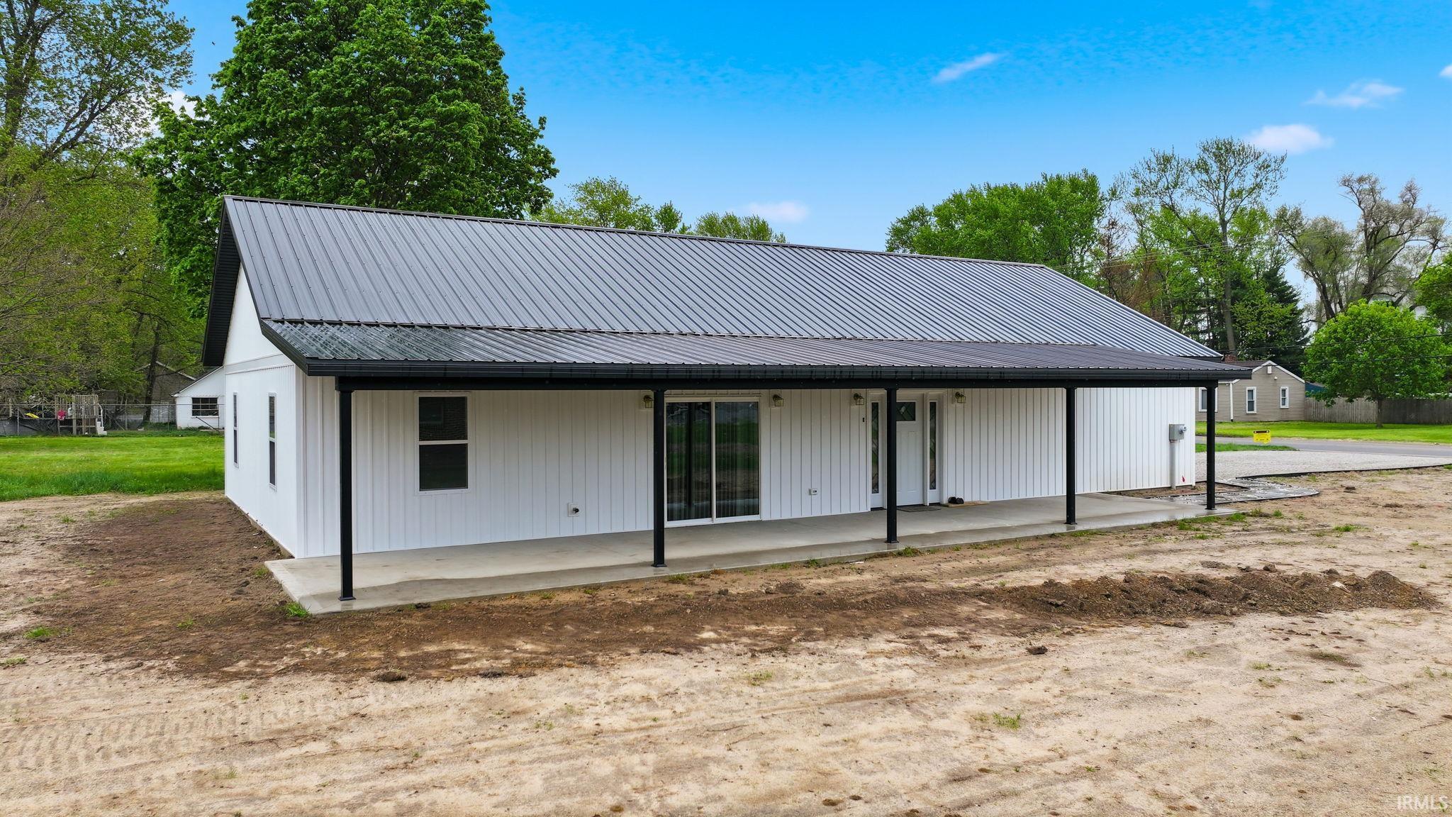 Contemporary home with white board and batten siding