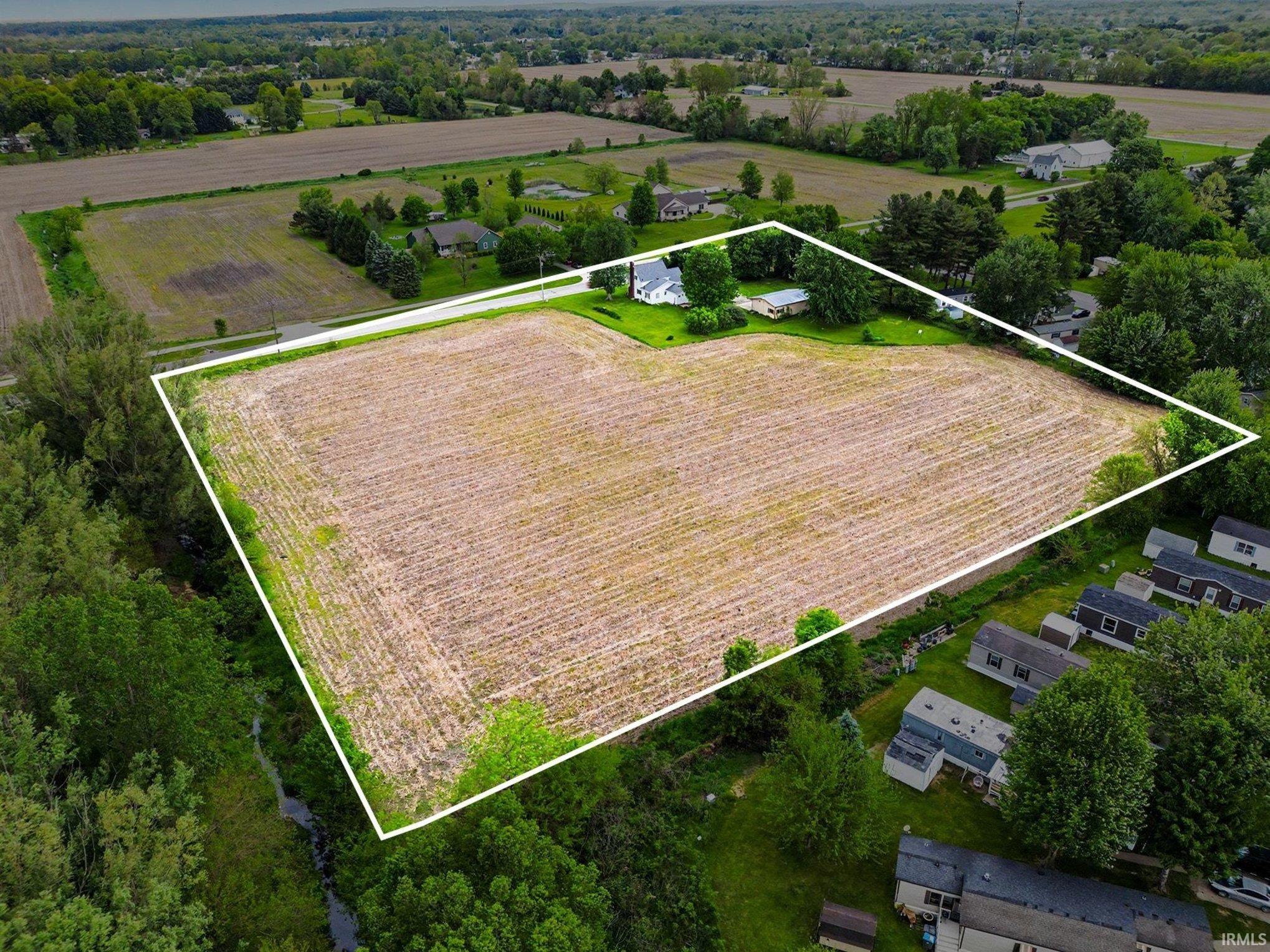 Expansive land parcel featuring a large cultivated field
