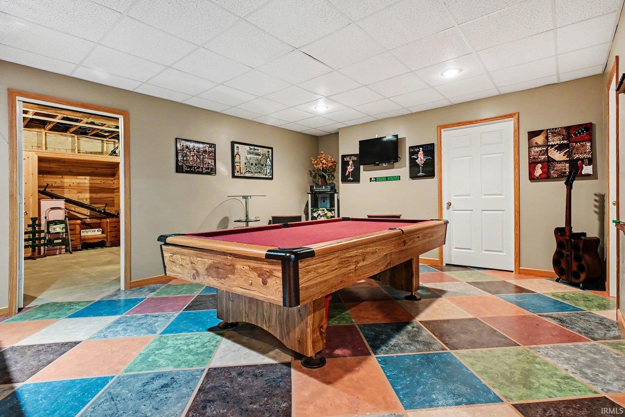 Recreation room featuring a pool table, multicolored diamond-patterned flooring, recessed lighting, and a drop ceiling