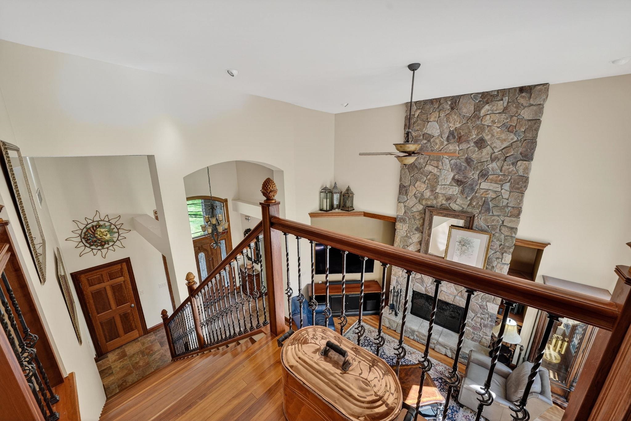 Hardwood flooring with wrought iron railing staircase