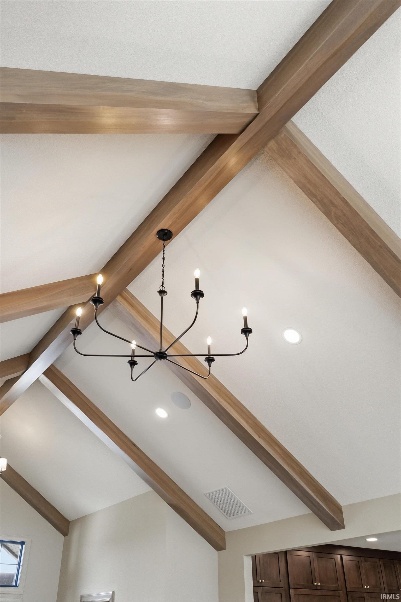 Vaulted ceiling with exposed wood-finish beams