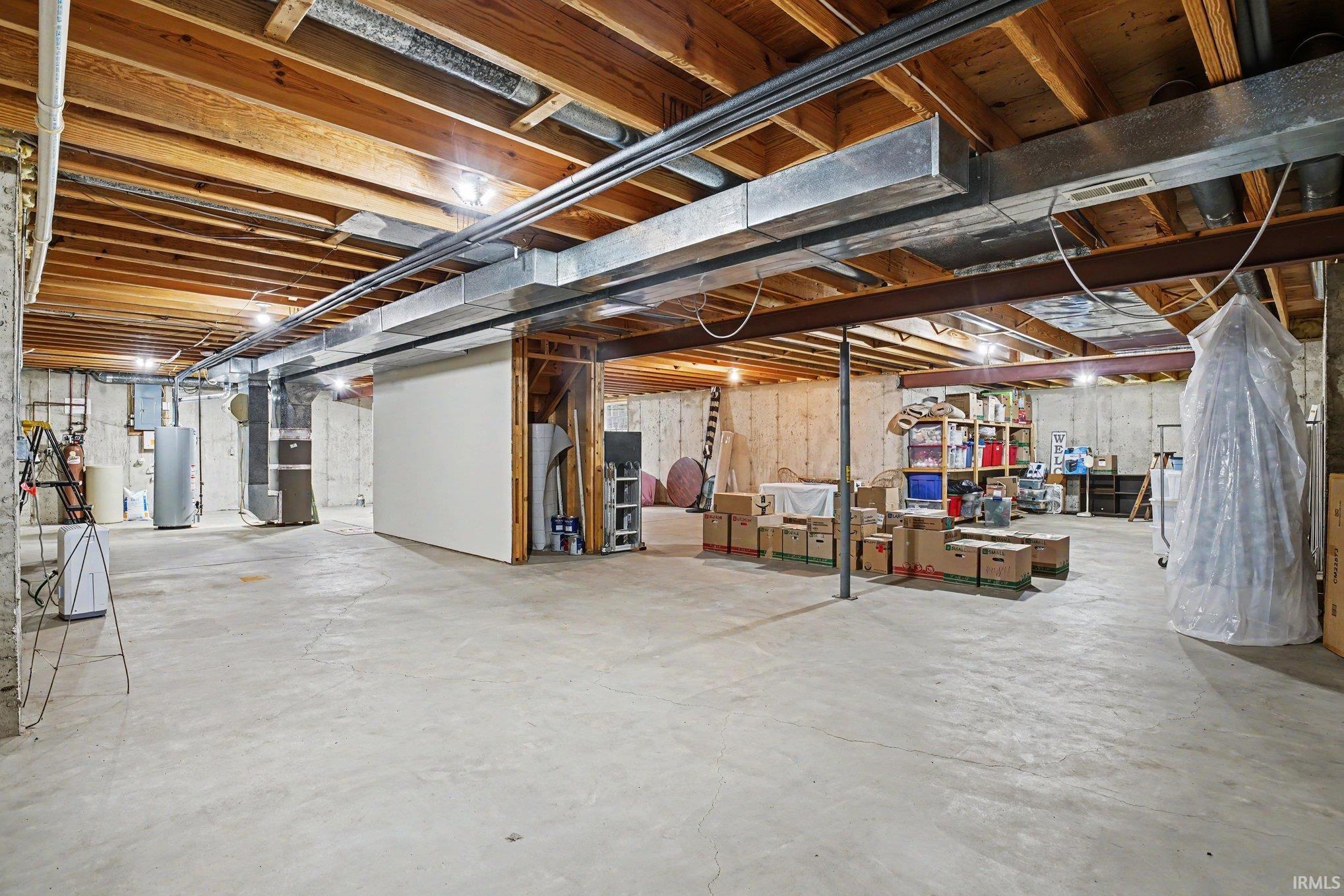 Unfinished basement with egress window and plumbing with lift pump for future options