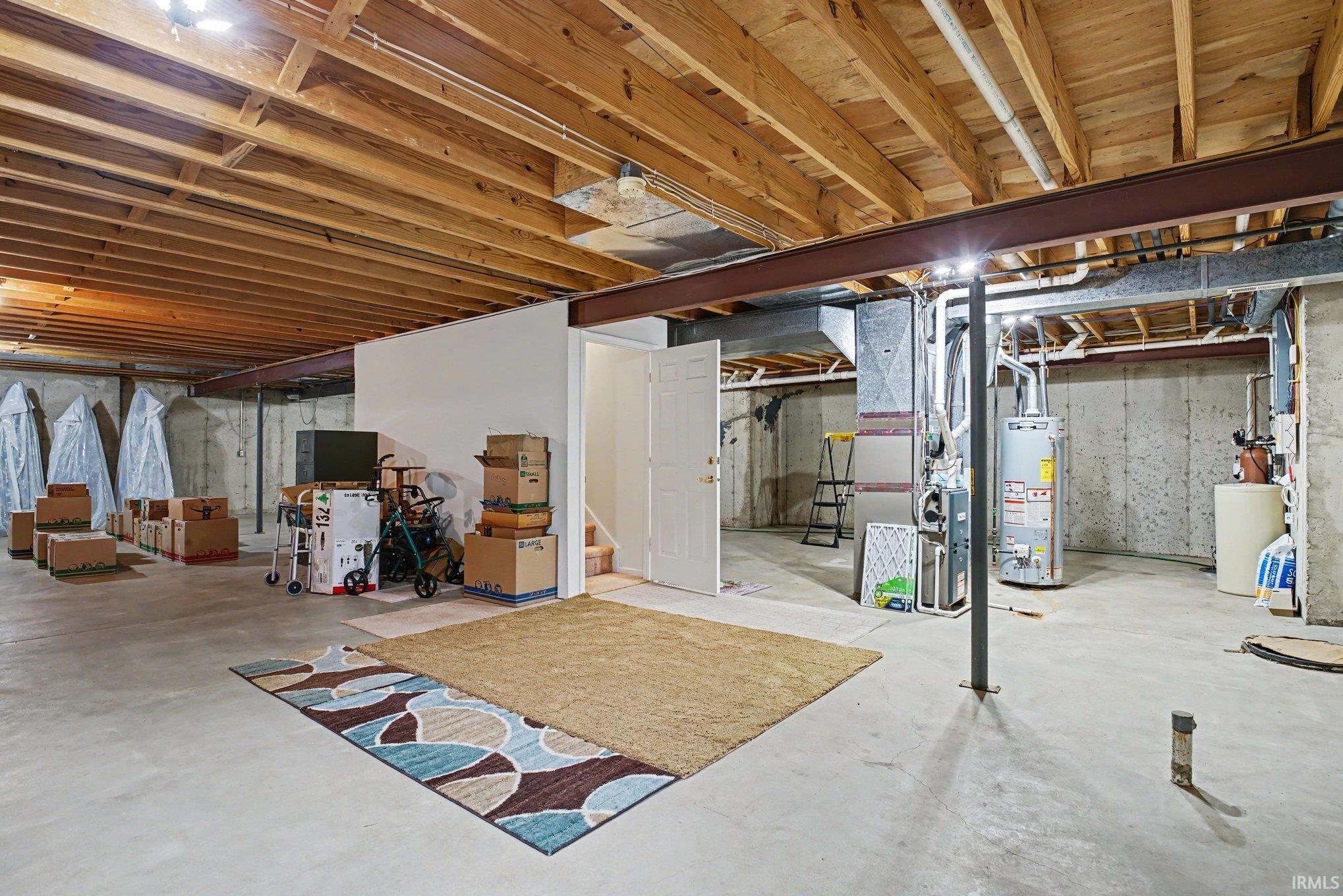 Unfinished basement with egress window and plumbing with lift pump for future options