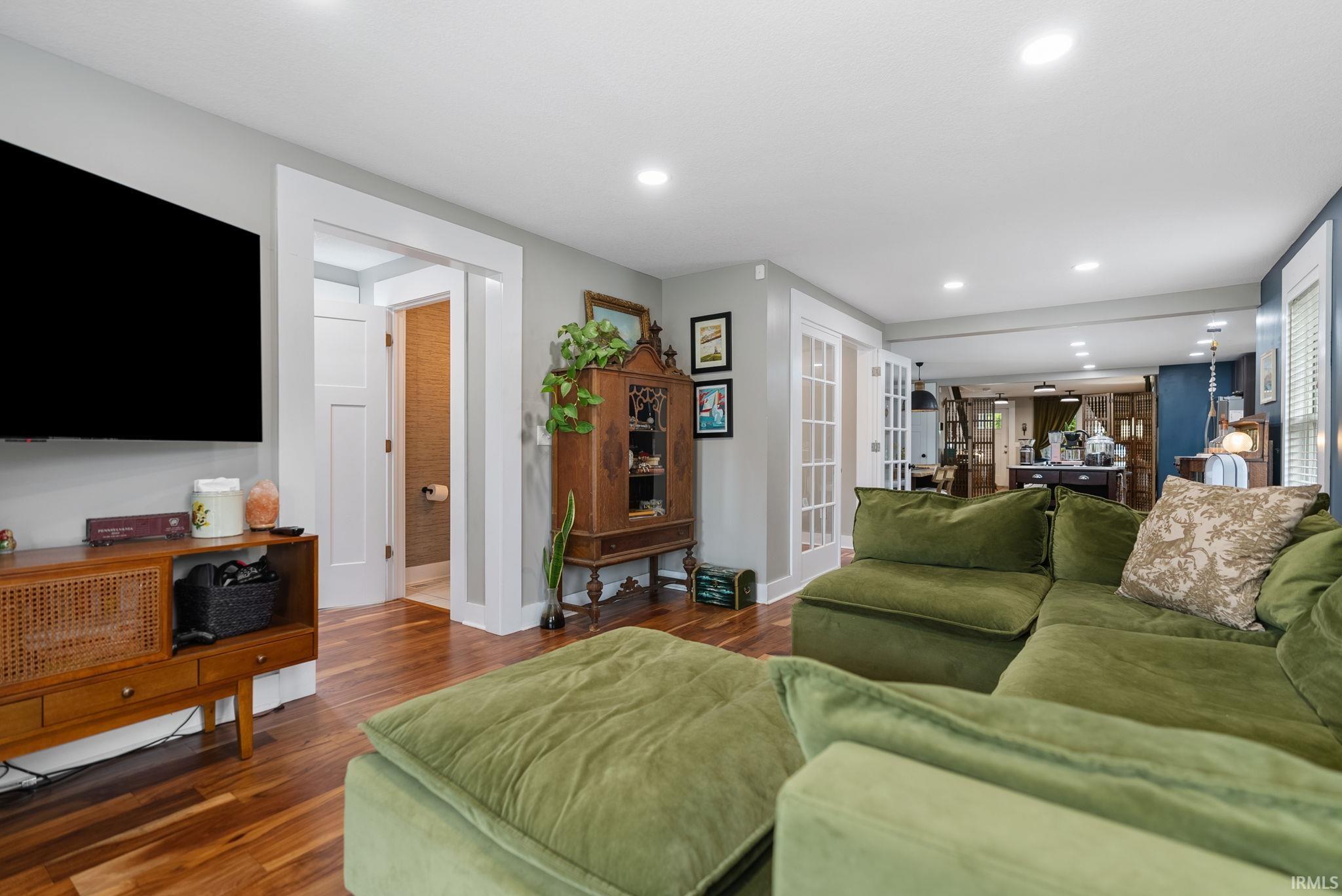 Hardwood flooring extends throughout this open-concept living space