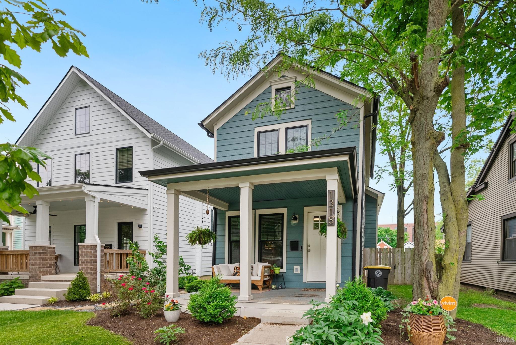 Blue siding exterior with white trim