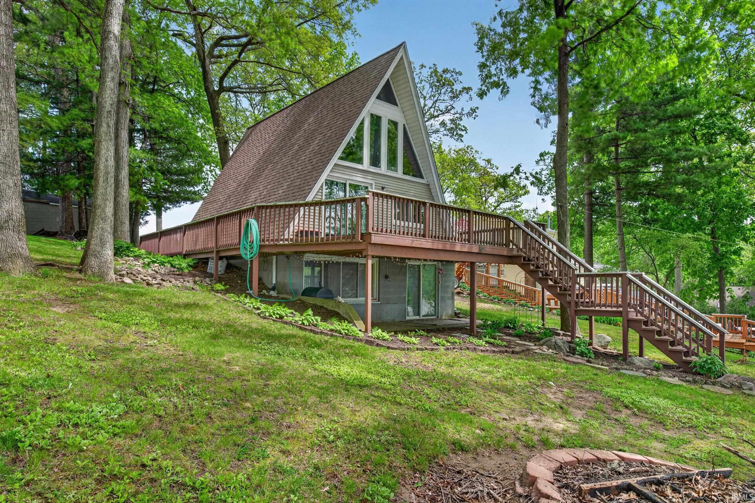 A-frame residence with a prominent gabled roofline and a front-facing deck