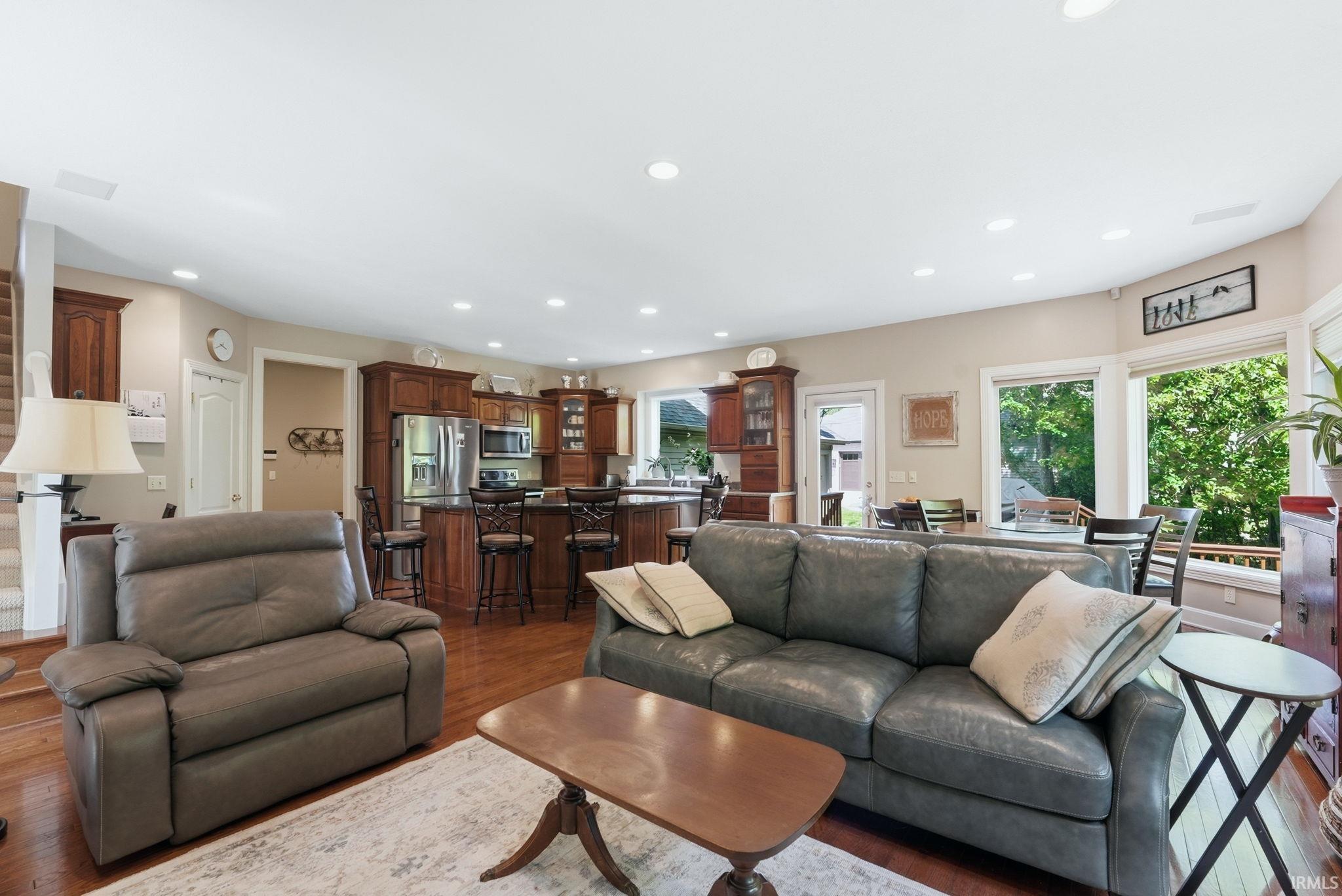 Open-concept living space featuring wood-finish flooring throughout